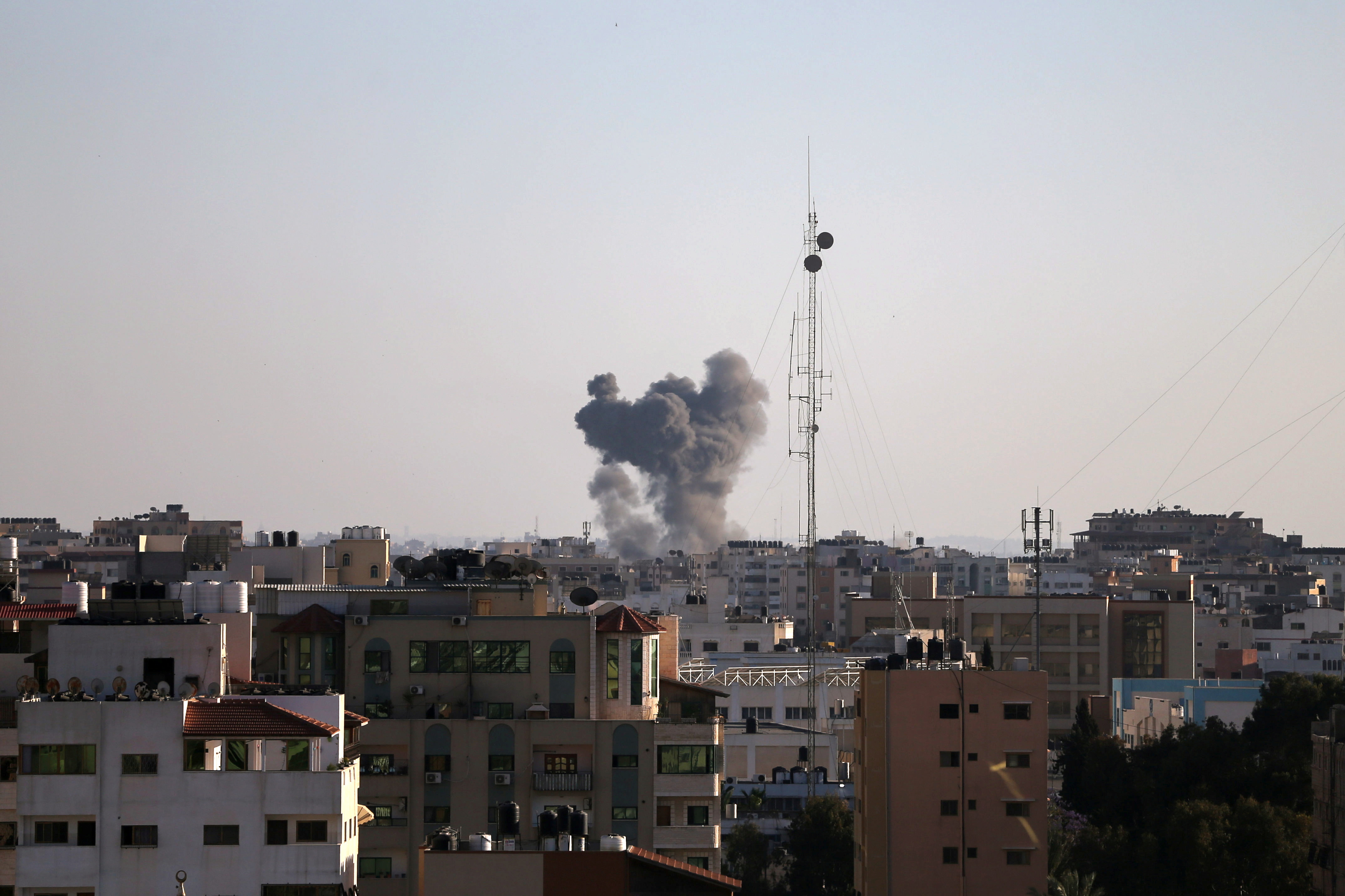 Smoke rises during an Israeli air strike, amid a flare-up of Israeli-Palestinian violence, in Gaza City May 13, 2021. REUTERS/Ibraheem Abu Mustafa