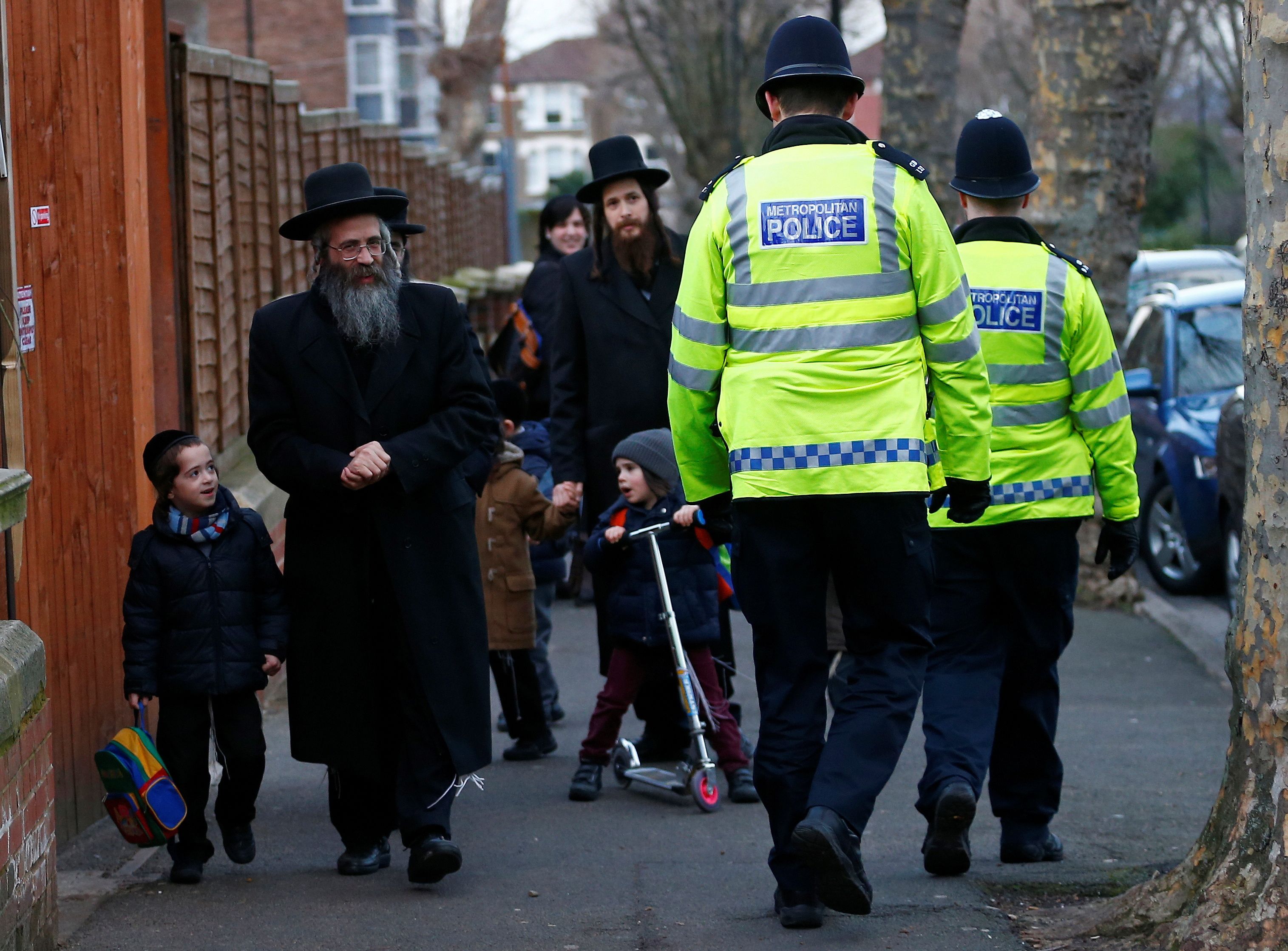 FILE PHOTO: Members of the Jewish community collect their children from school in north London