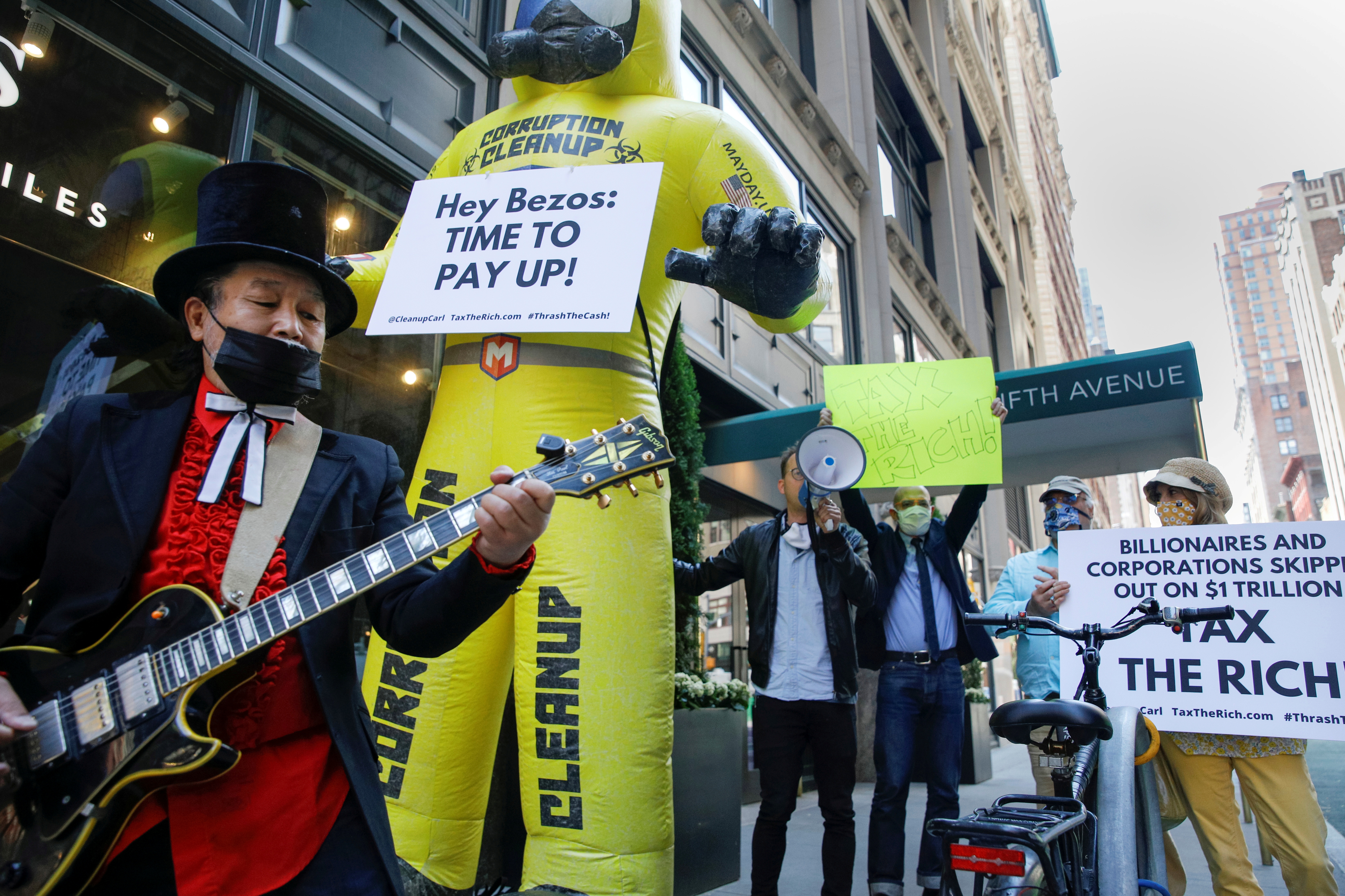 Members of the Patriotic Millionaires hold a federal tax filing day protest in New York