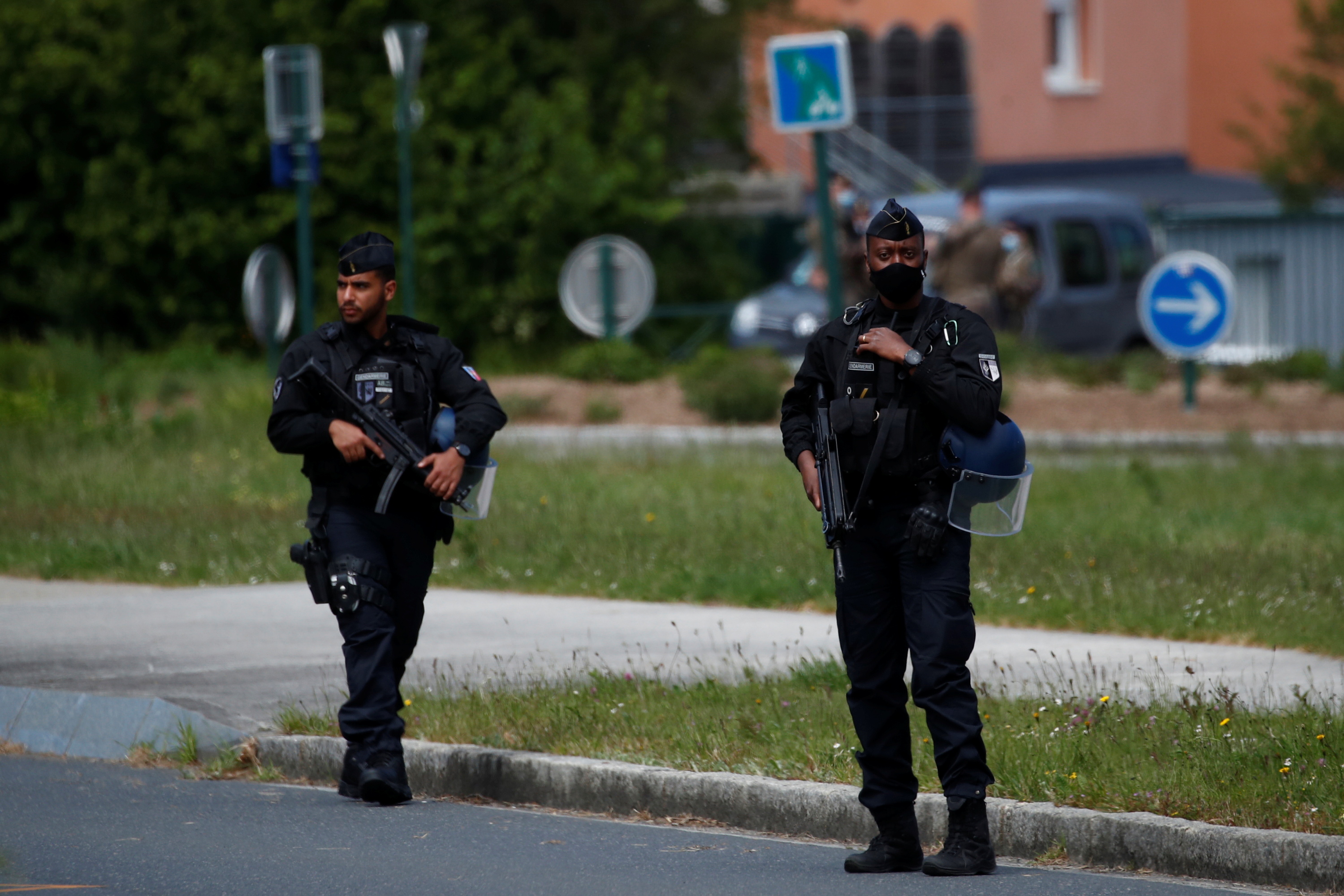 French gendarmes secure the area after an assailant stabbed and badly wounded a policewoman in La Chapelle-sur-Erdre, western France, May 28, 2021. REUTERS/Stephane Mahe