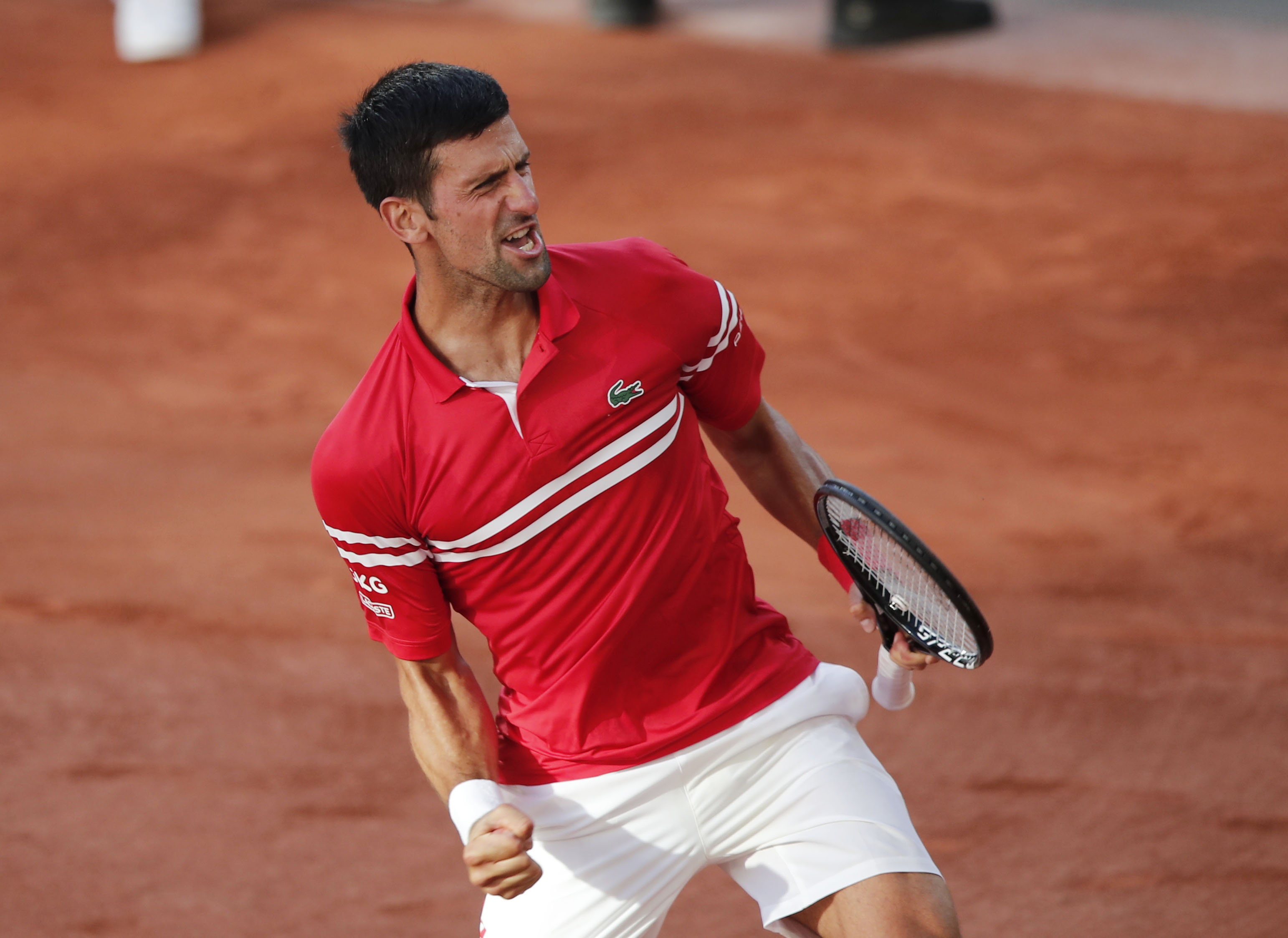 Tennis - French Open - Roland Garros, Paris, France - June 13, 2021 Serbia's Novak Djokovic celebrates winning the final against Greece's Stefanos Tsitsipas REUTERS/Benoit Tessier
