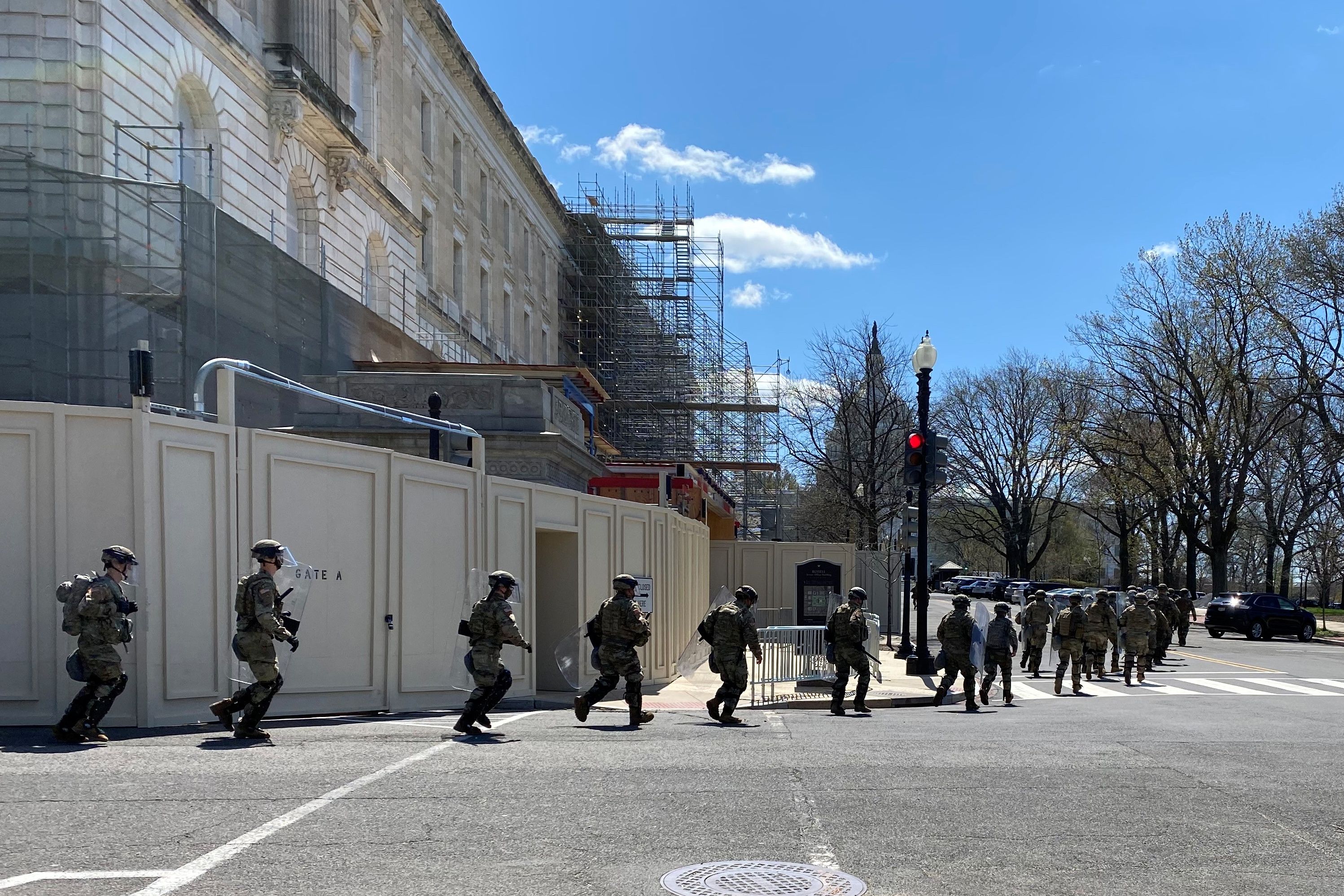 National Guard troops run towards the U.S. Capitol during a security incident in Washington, U.S. April 2, 2021.   REUTERS/Peter Eisler