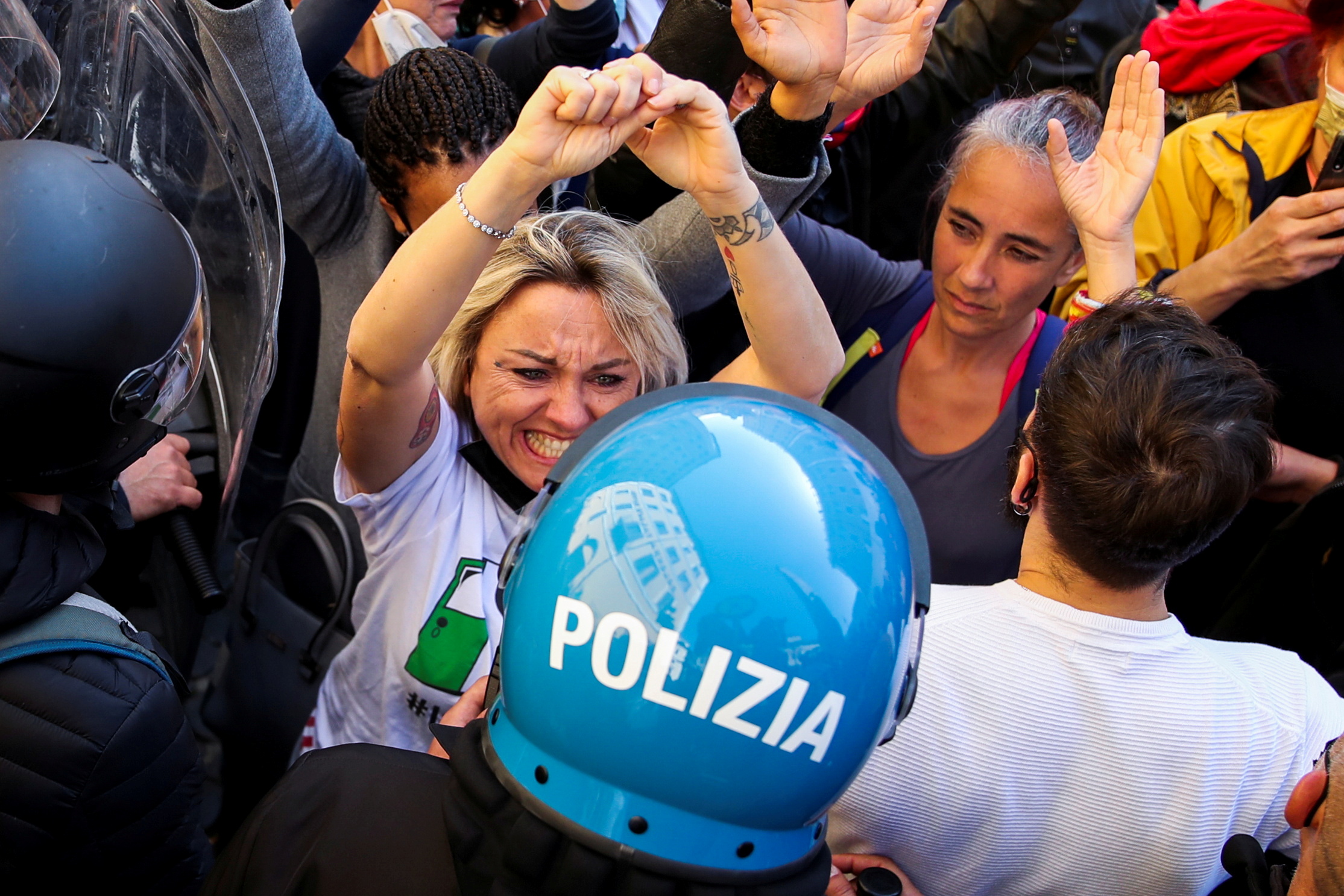 A woman reacts as restaurant owners scuffle with police as tensions rise over COVID-19 restrictions on businesses, in Rome, Italy April 6, 2021. REUTERS/Yara Nardi     TPX IMAGES OF THE DAY