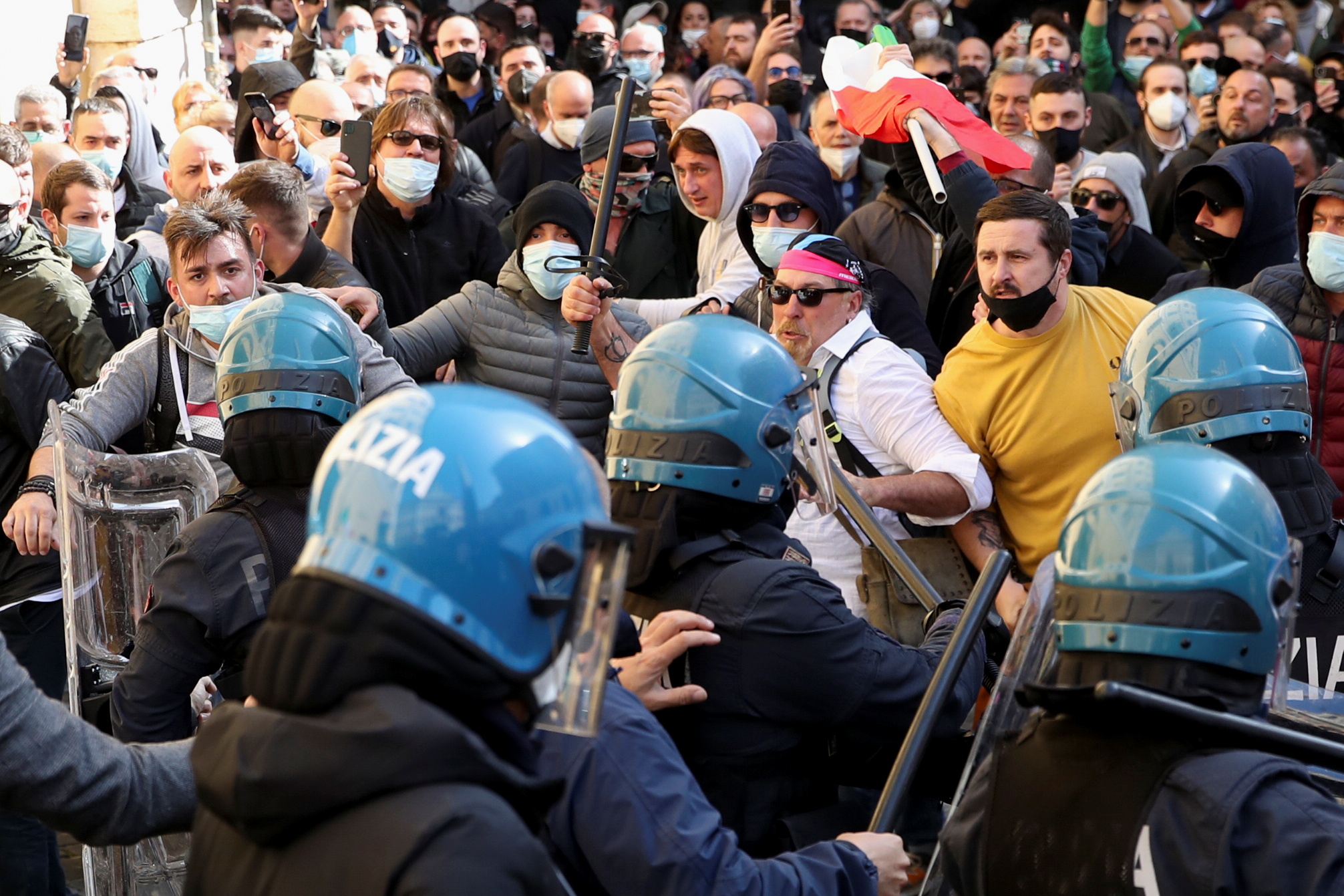 People face police as restaurant owners demonstrate as tensions rise over COVID-19 restrictions on businesses, in Rome, Italy April 6, 2021. REUTERS/Yara Nardi