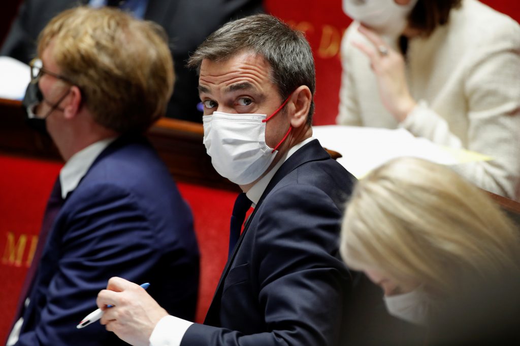 French Health Minister Olivier Veran, wearing a protective face mask, attends the questions to the government session at the National Assembly in Paris amid the coronavirus disease (COVID-19) outbreak in France, March 16, 2021. REUTERS/Gonzalo Fuentes