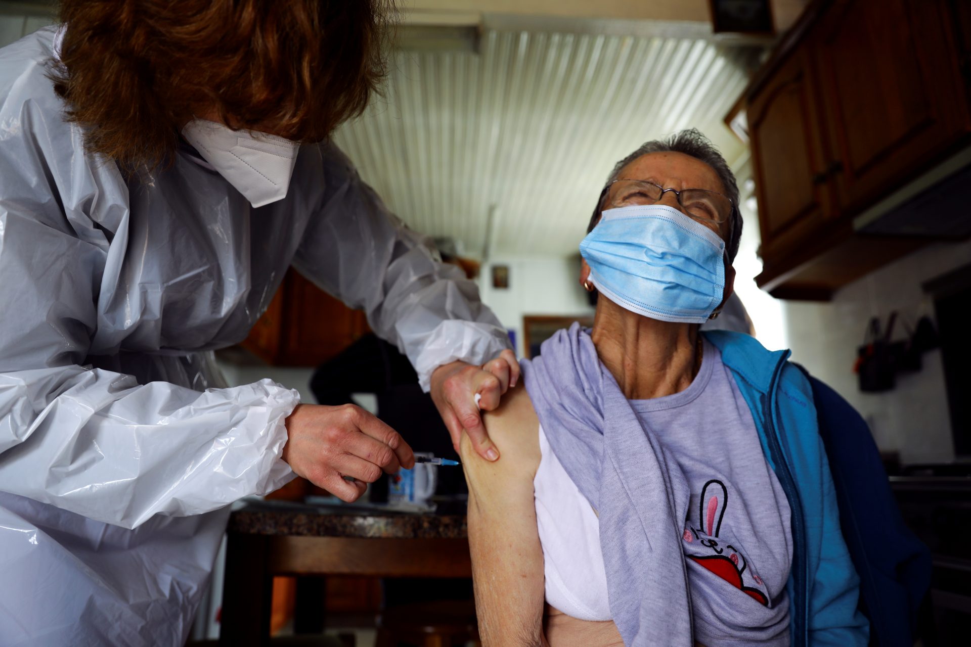 An elderly resident is vaccinated against the coronavirus disease (COVID-19) under an initiative by the Calouste Gulbenkian Foundation in Sabrosa, Portugal, April 9, 2021. REUTERS/Violeta Santos Moura