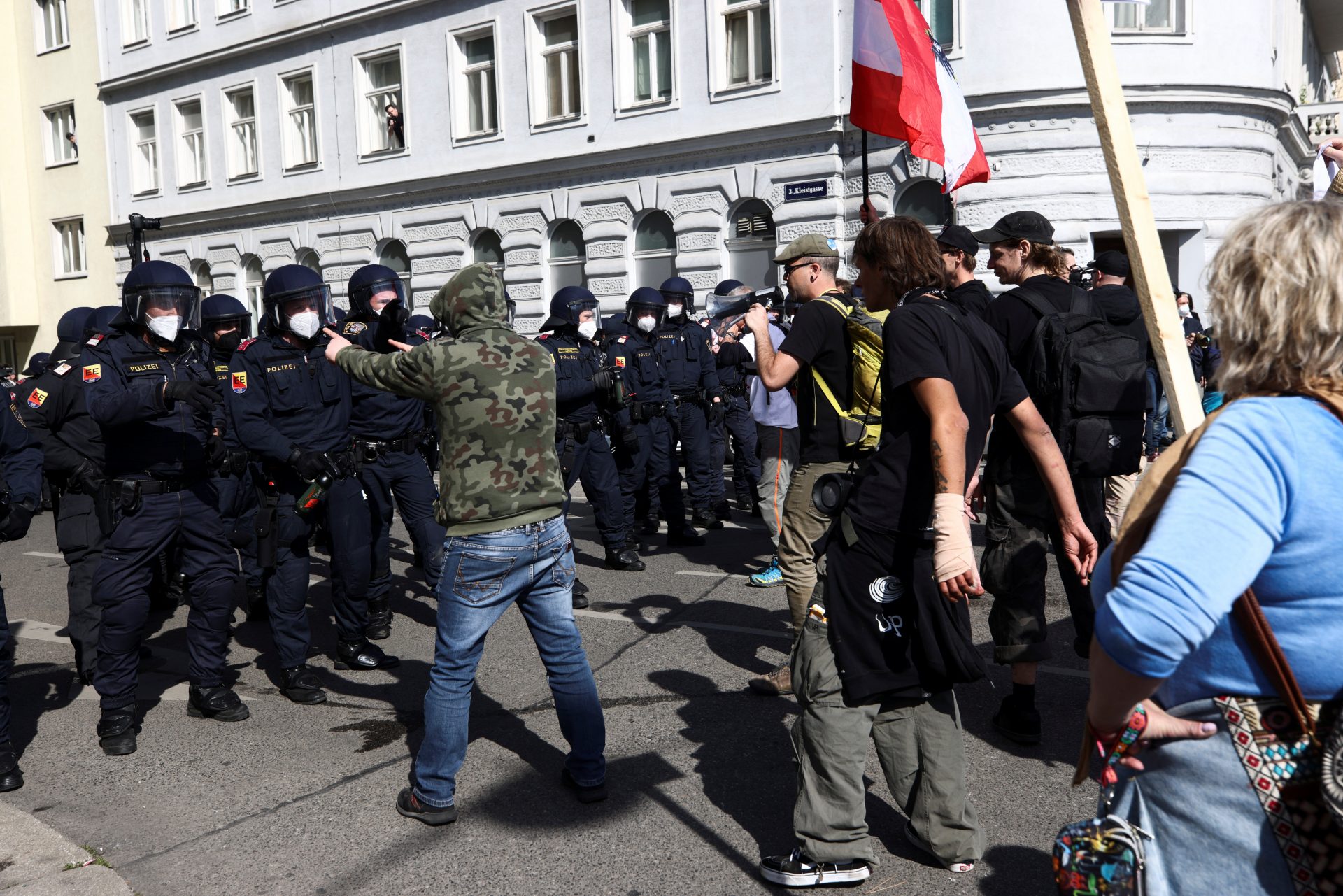 Demonstrators face off police officers during a protest against the coronavirus disease (COVID-19) measures in Vienna, Austria, April 10, 2021. REUTERS/Lisi Niesner