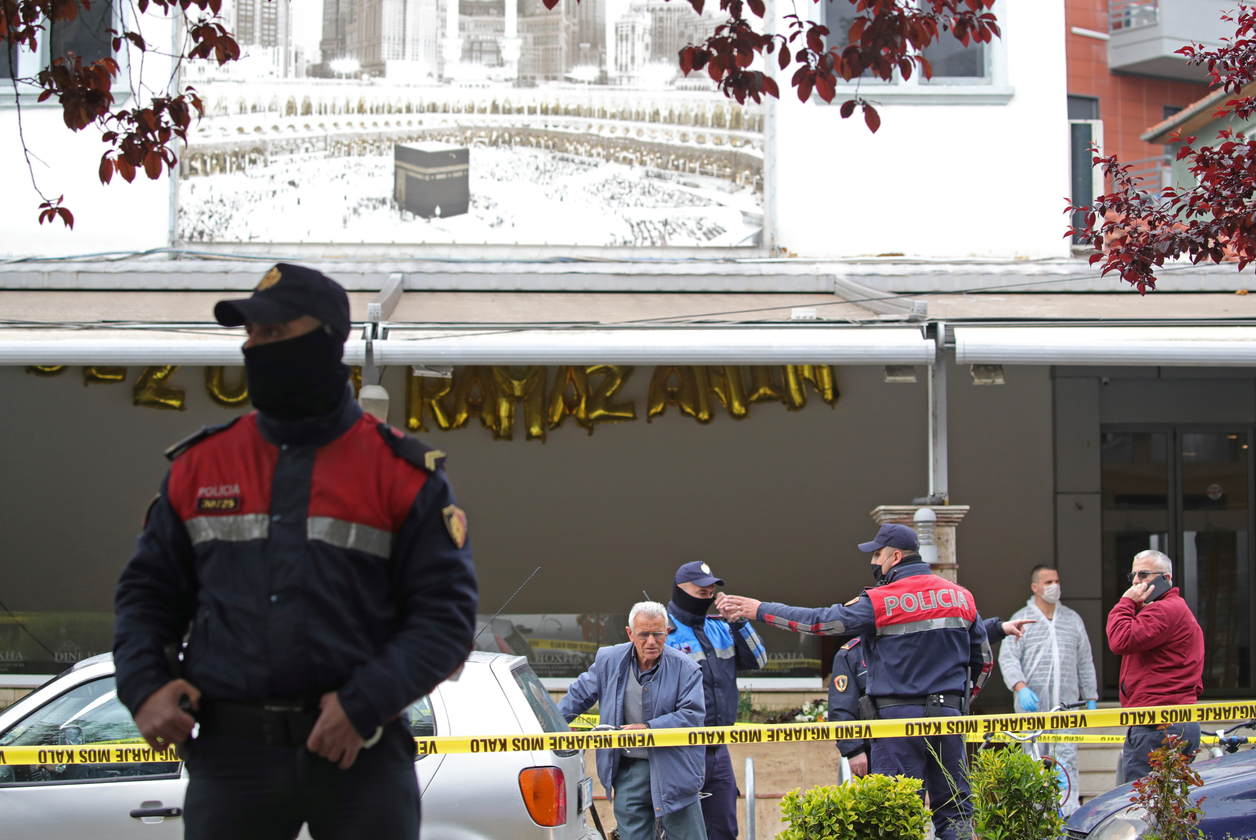 Albanian police officers are seen in front of Dine Hoxha mosque after a knife attack, in Tirana, Albania April 19, 2021. REUTERS/Florion Goga