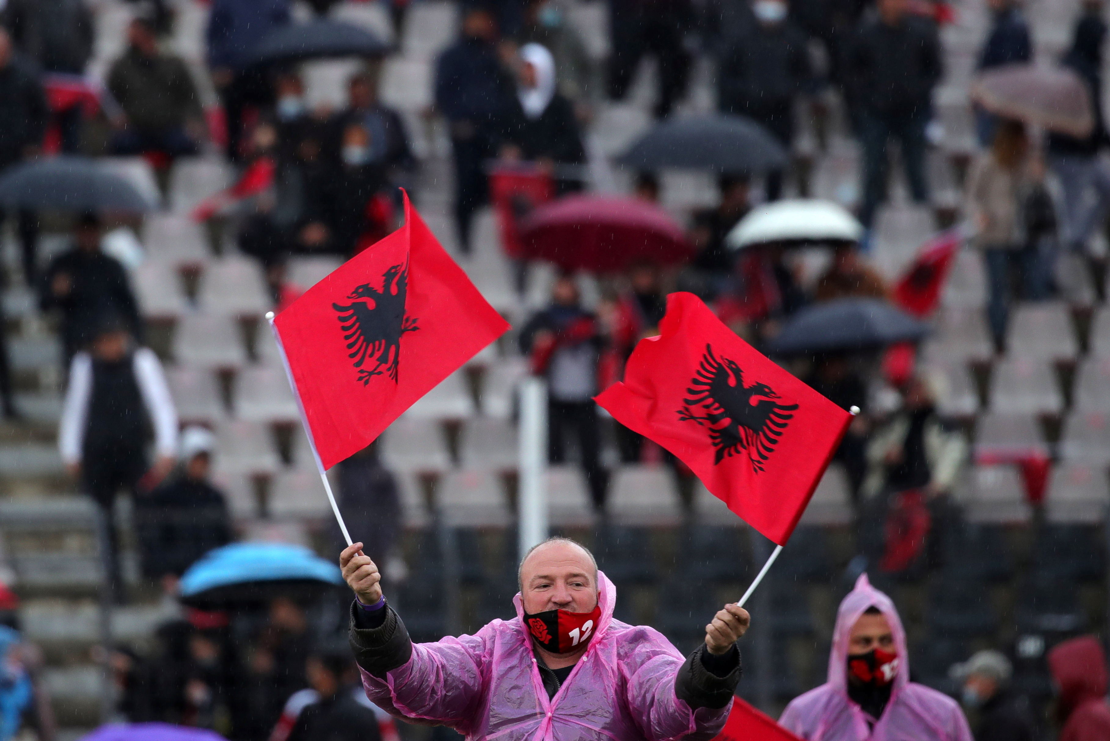 Supporter of the Socialist Party waves Albanian national flags during an election rally in Elbasan, Albania April 20, 2021. REUTERS/Florion Goga