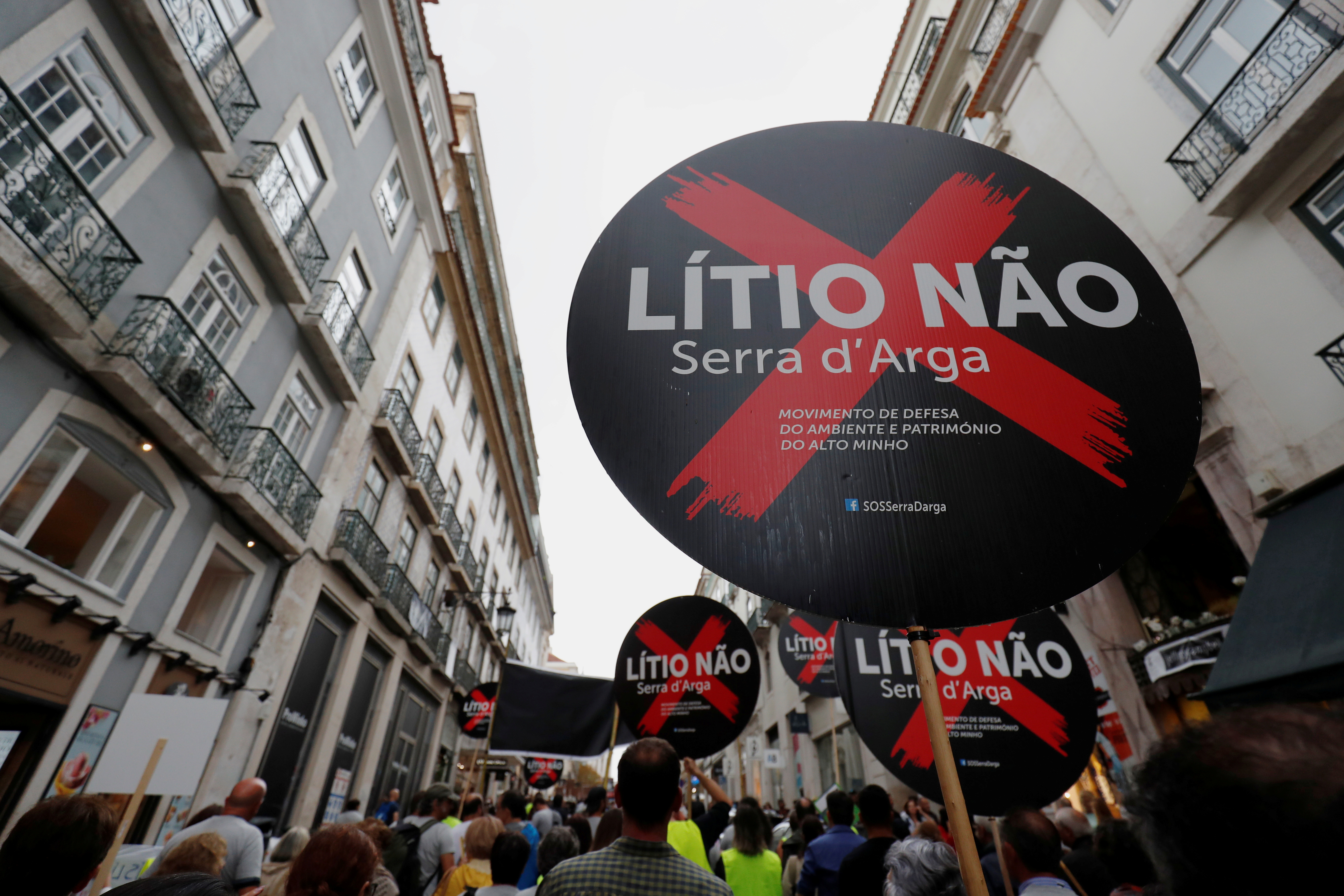 FILE PHOTO: Demonstrators protest against lithium mines in downtown Lisbon, Portugal September 21, 2019. The placards read "Lithium Not". Picture taken September 21, 2019.  REUTERS/Rafael Marchante/File Photo