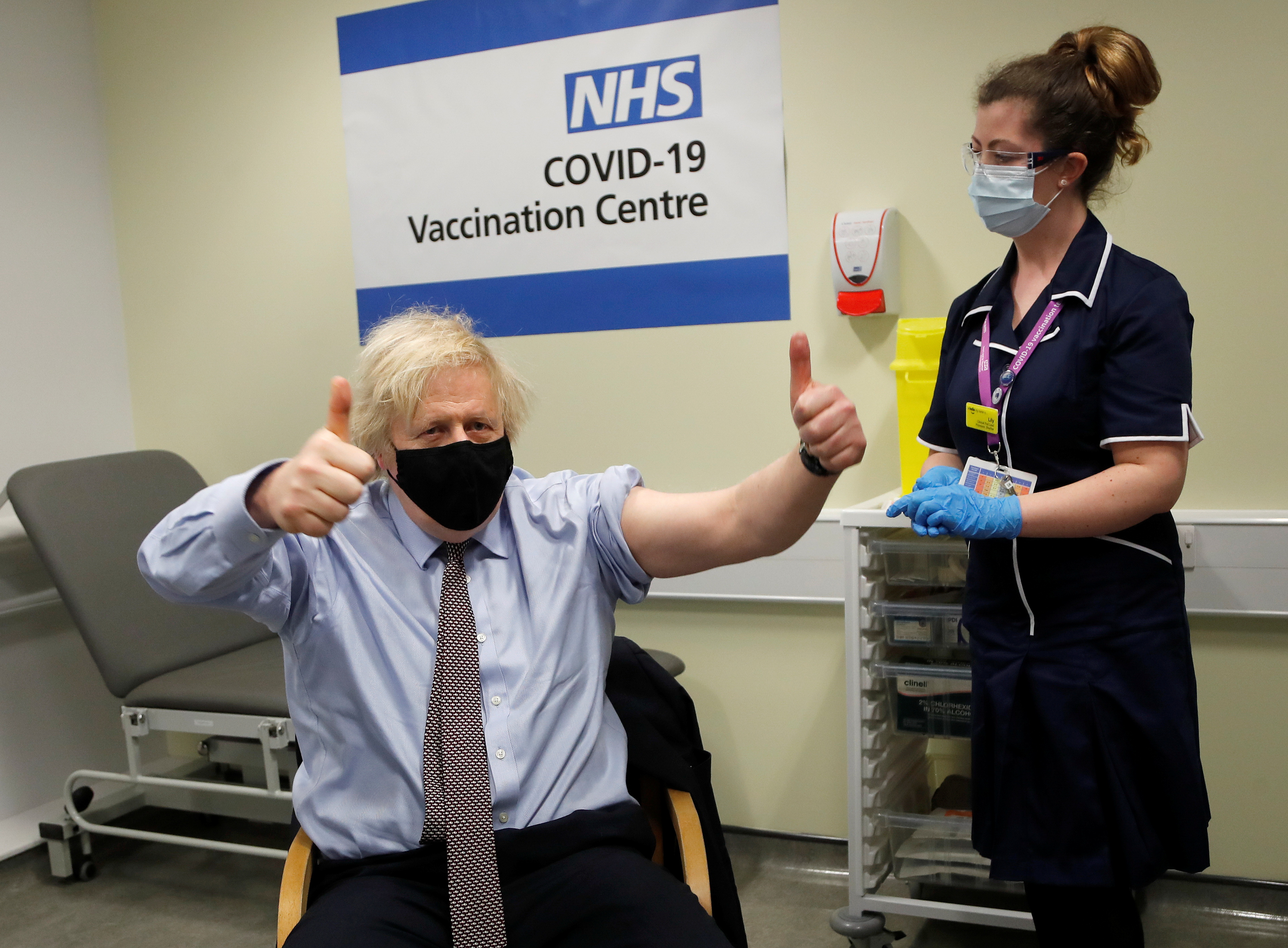 British Prime Minister Boris Johnson reacts after receiving a dose of the Oxford/AstraZeneca COVID-19 vaccine, amid the coronavirus disease pandemic, in London, Britain March 19, 2021. Frank Augstein/Pool via REUTERS