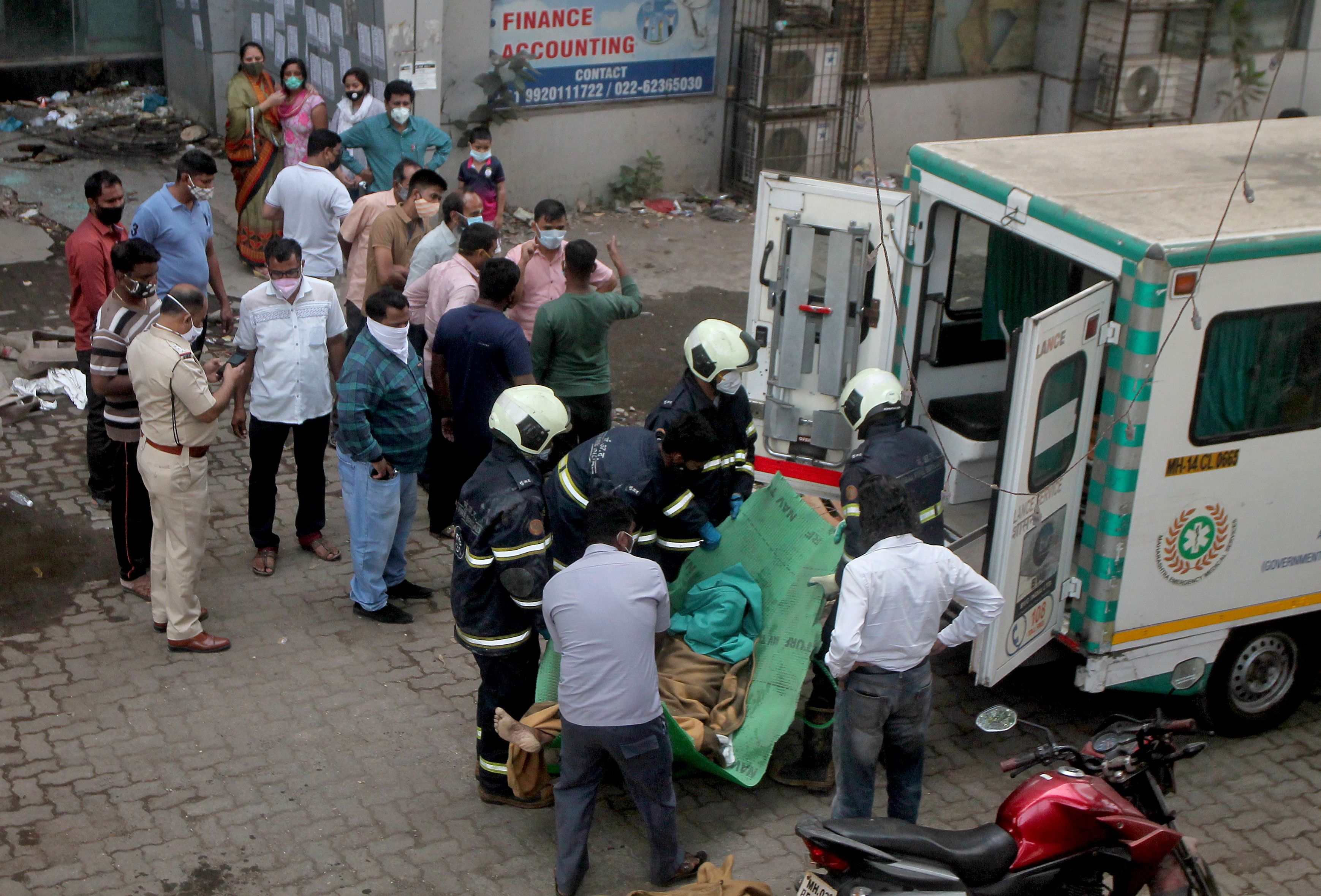 SENSITIVE MATERIAL. THIS IMAGE MAY OFFEND OR DISTURB  Firefighters load the body of a victim onto an ambulance after a fire broke out at a coronavirus disease (COVID-19) hospital in Mumbai, India, March 26, 2021. REUTERS/Stringer NO ARCHIVES. NO RESALES.