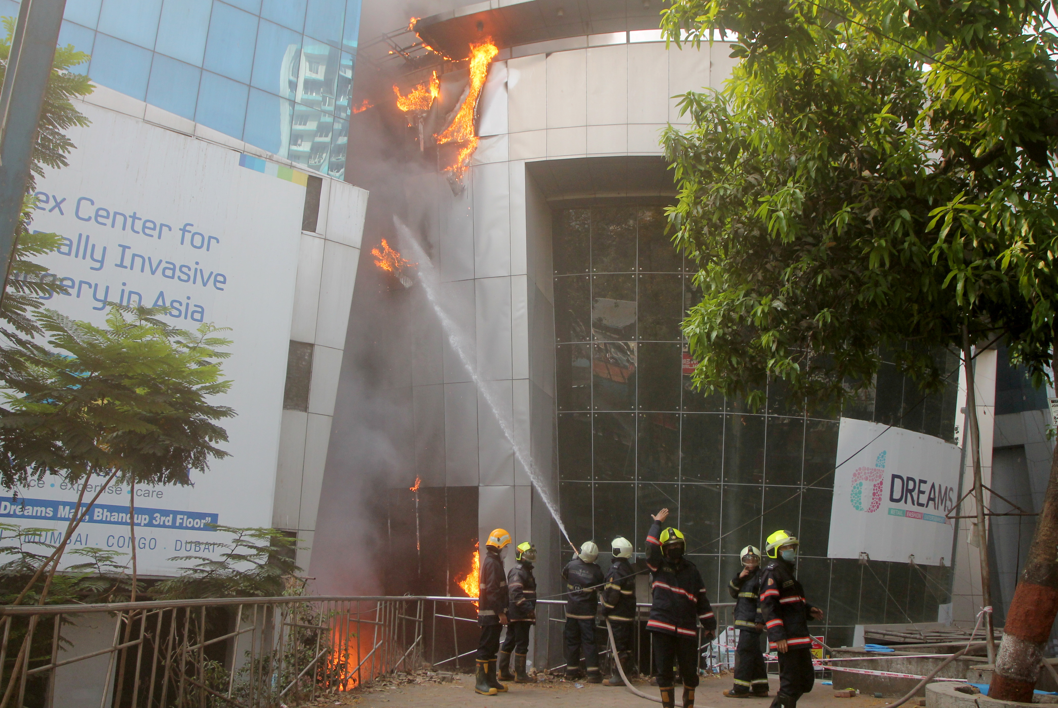 FILE PHOTO: Firefighters try to douse a fire that broke out at a coronavirus disease (COVID-19) hospital in Mumbai, India, March 26, 2021. REUTERS/Stringer NO ARCHIVES. NO RESALES./File Photo