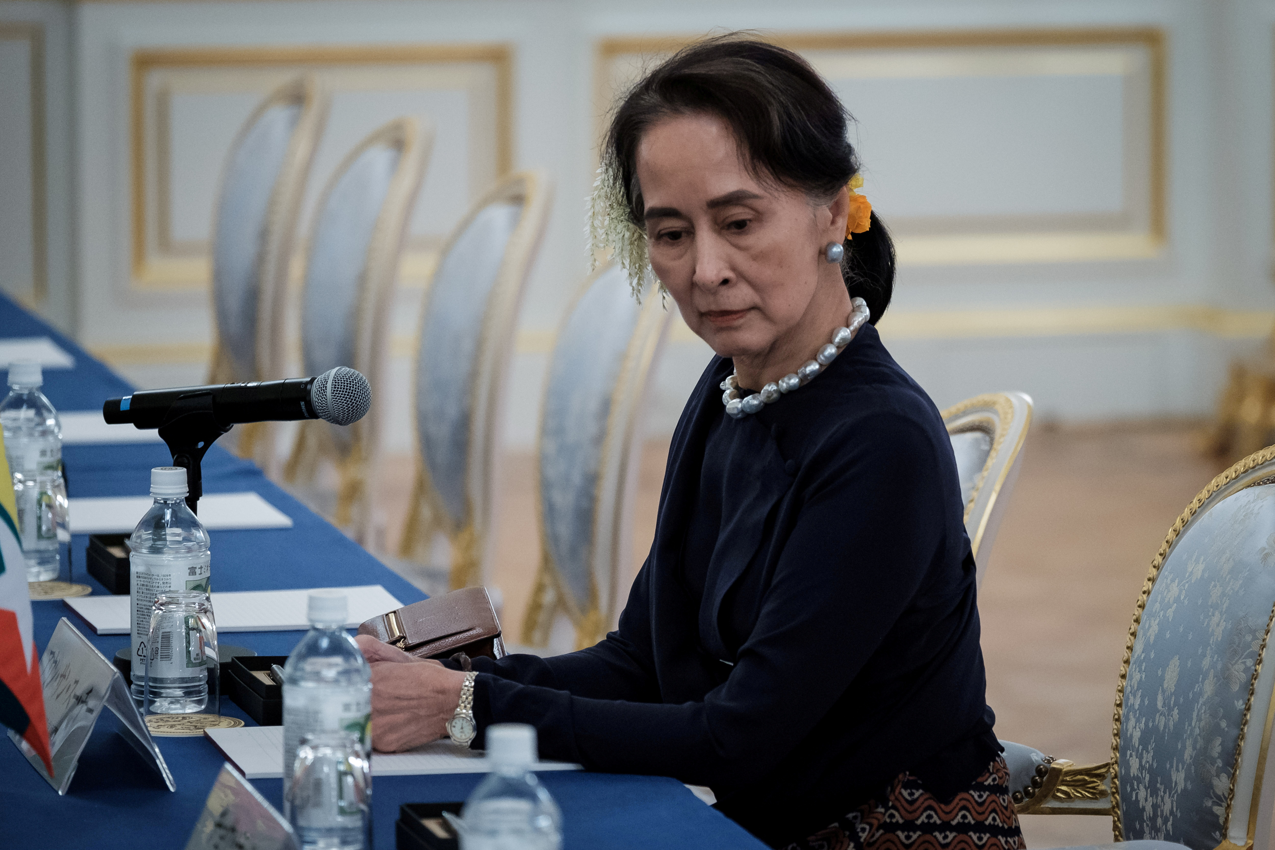 FILE PHOTO: Myanmar's State Counsellor Aung San Suu Kyi waits for arrival of her delegation before Japan Myanmar Summit meeting in Tokyo