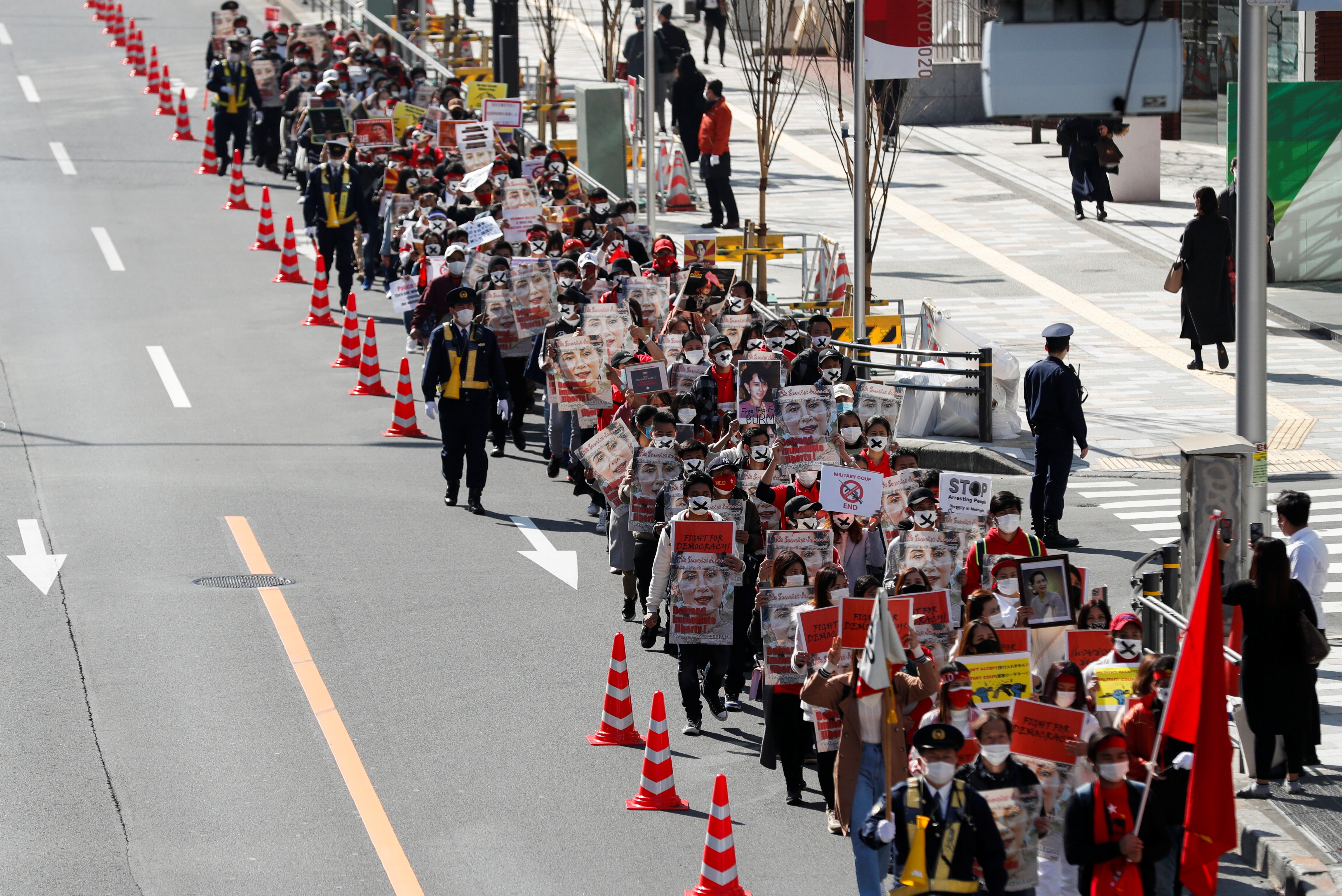 Demonstrators march to protest against the military coup in Myanmar, in central Tokyo, Japan February 14, 2021. REUTERS/Kim Kyung-Hoon