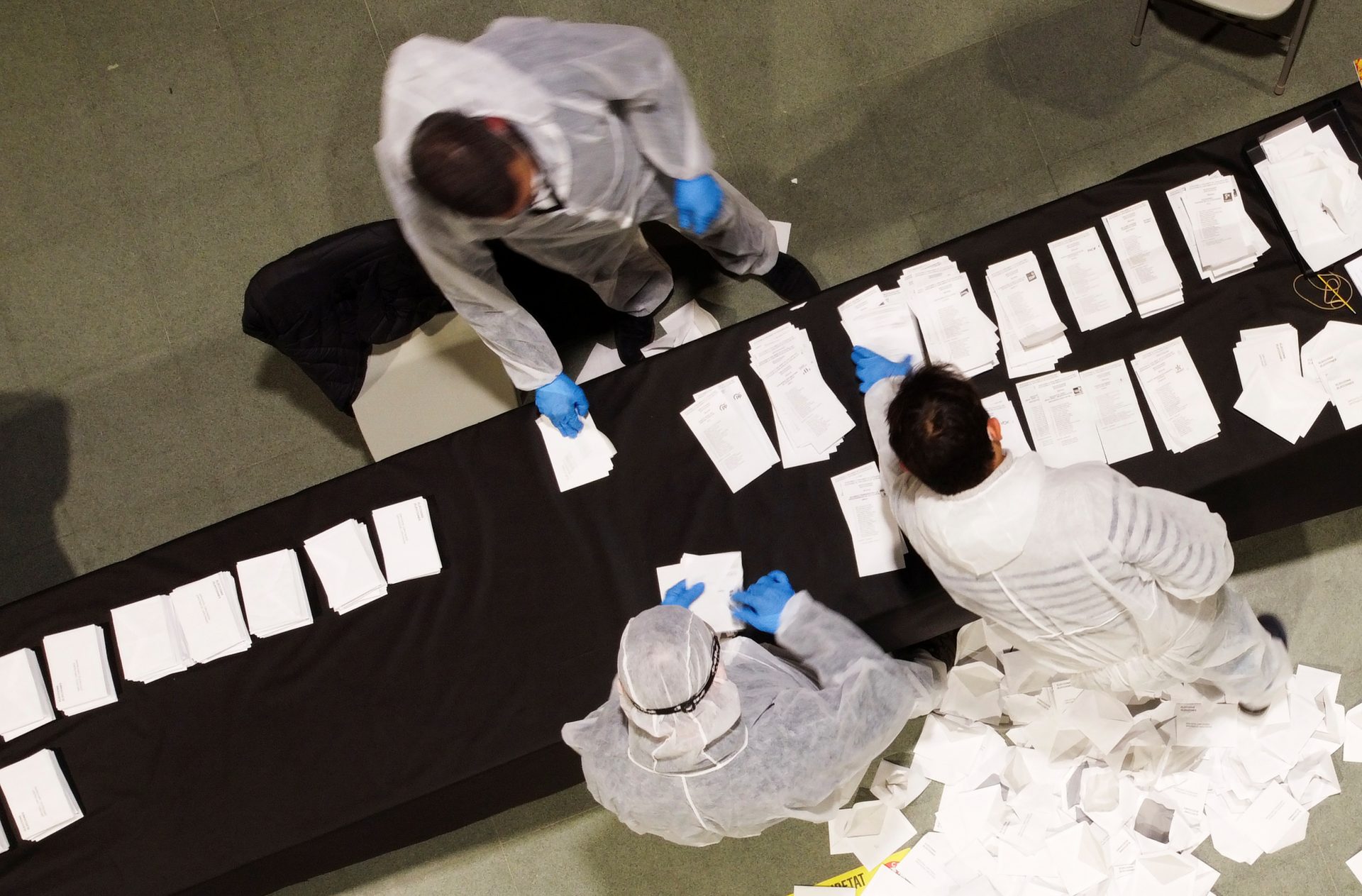 Elector workers count votes of citizens at a polling station during the regional election in Catalonia, amid the outbreak of the coronavirus disease (COVID-19), in Sant Julia de Ramis, near Girona, Spain, February 14, 2021. REUTERS/Nacho Doce