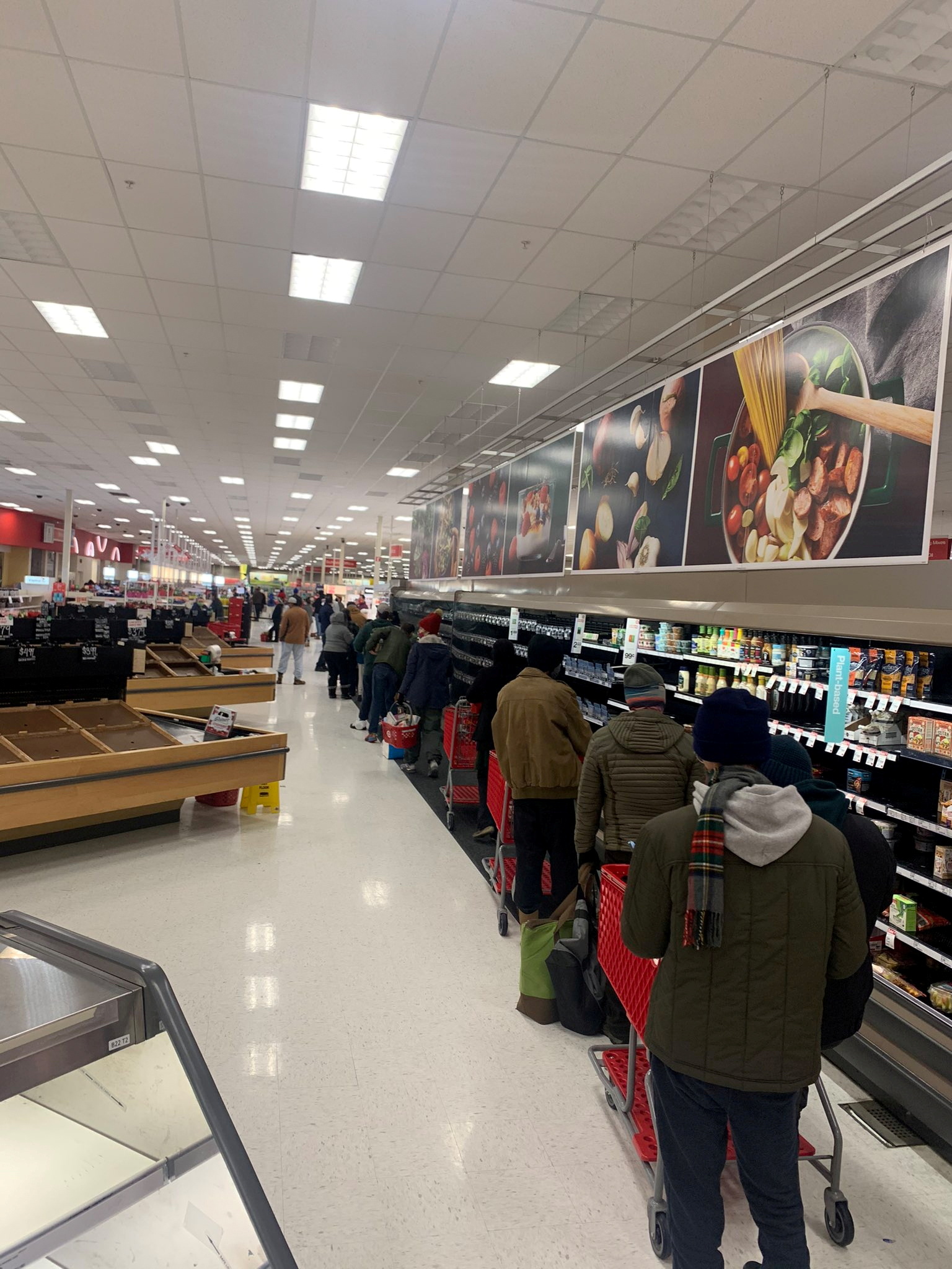 People form a line towards the cashier at a supermarket in Austin, Texas, U.S. February 17, 2021. Kolby Lee via REUTERS   ATTENTION EDITORS - THIS IMAGE HAS BEEN SUPPLIED BY A THIRD PARTY. NO RESALES. NO ARCHIVES. MANDATORY CREDIT. MUST CREDIT KOLBY LEE.