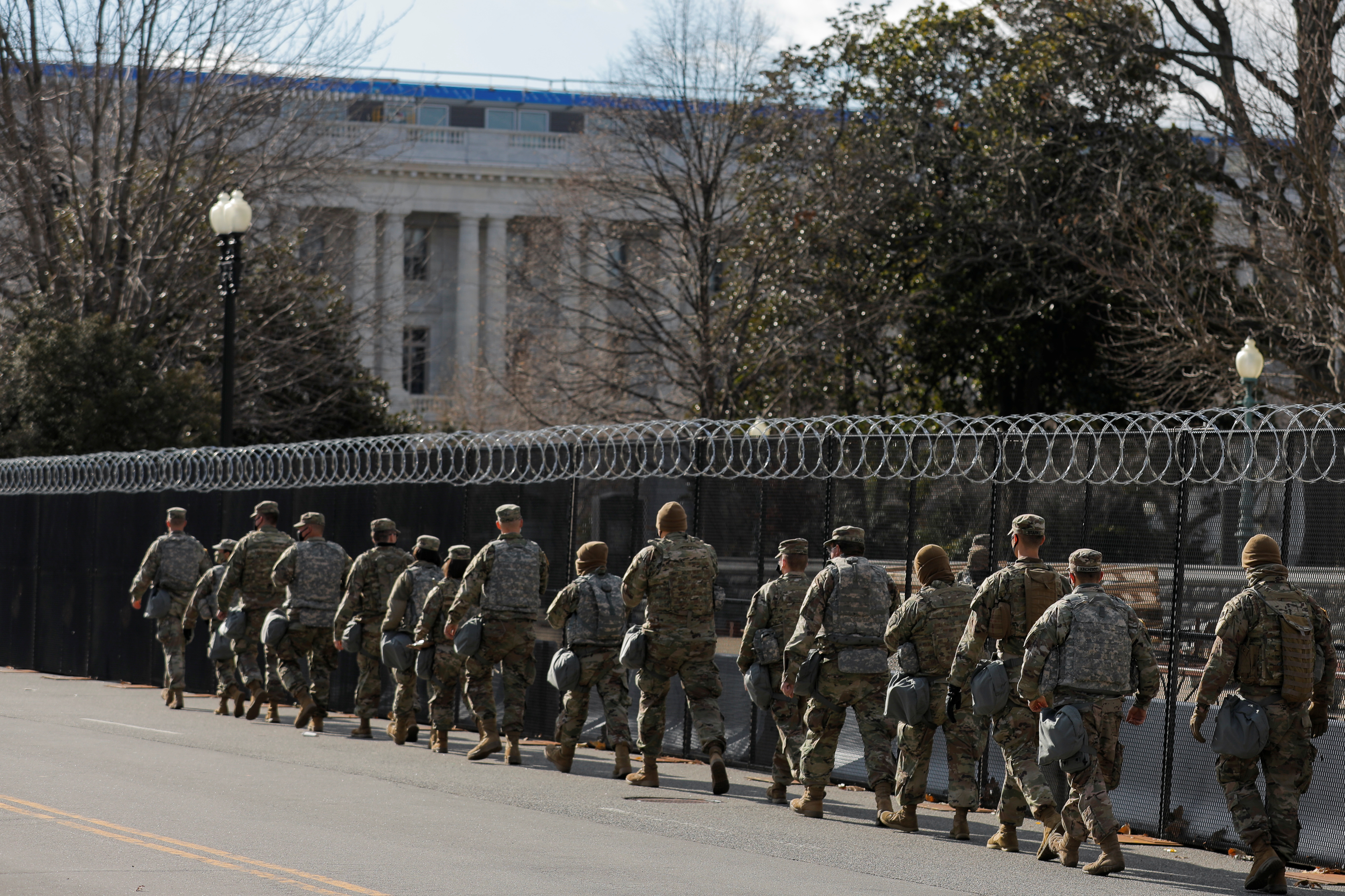 Members of the National Guard patrol near the U.S. Capitol building ahead of U.S. President-elect Joe Biden's inauguration, in Washington, U.S., January 19, 2021. REUTERS/Andrew Kelly