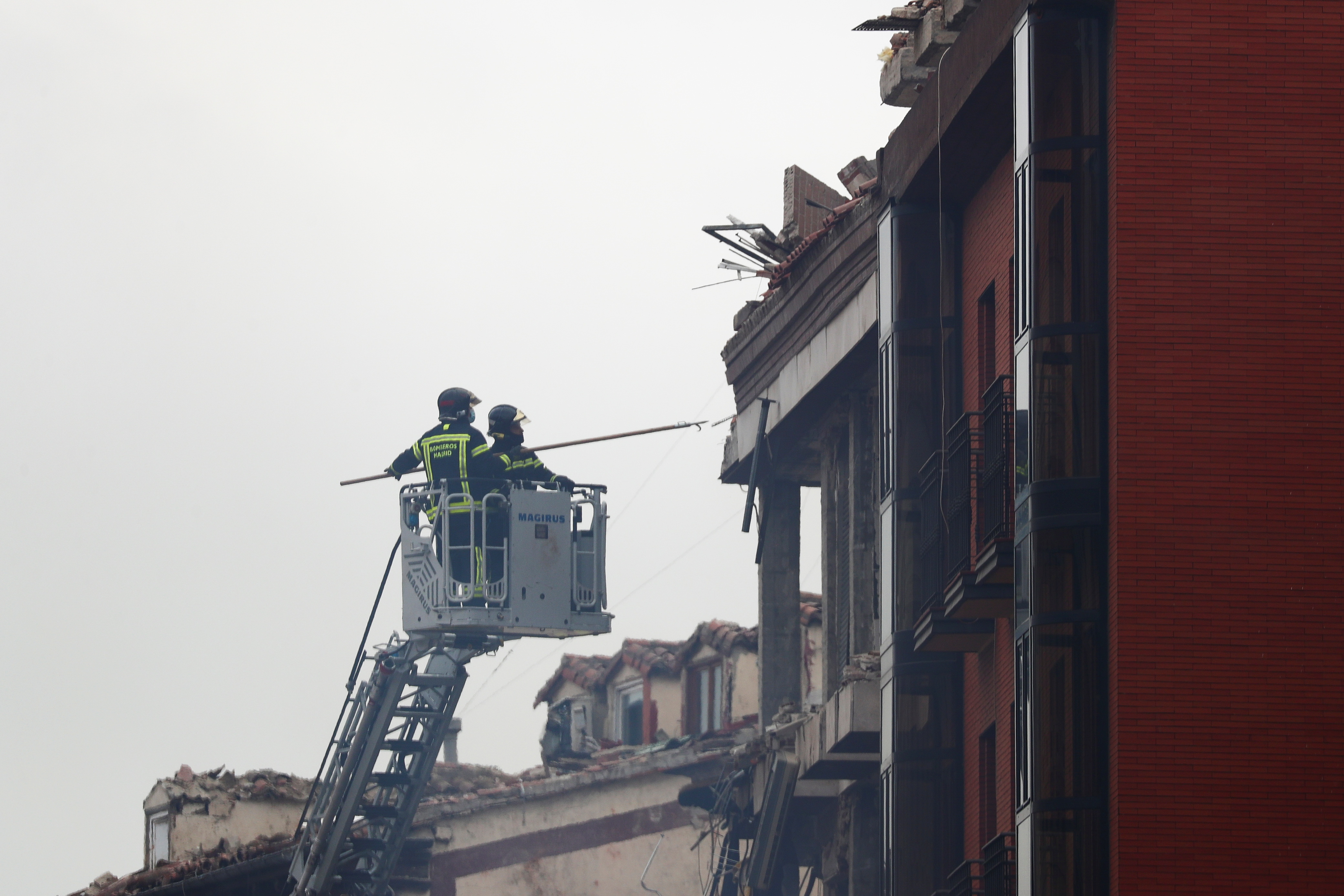 Fire fighters work after an explosion in Madrid downtown, Spain January 20, 2021. REUTERS/Sergio Perez
