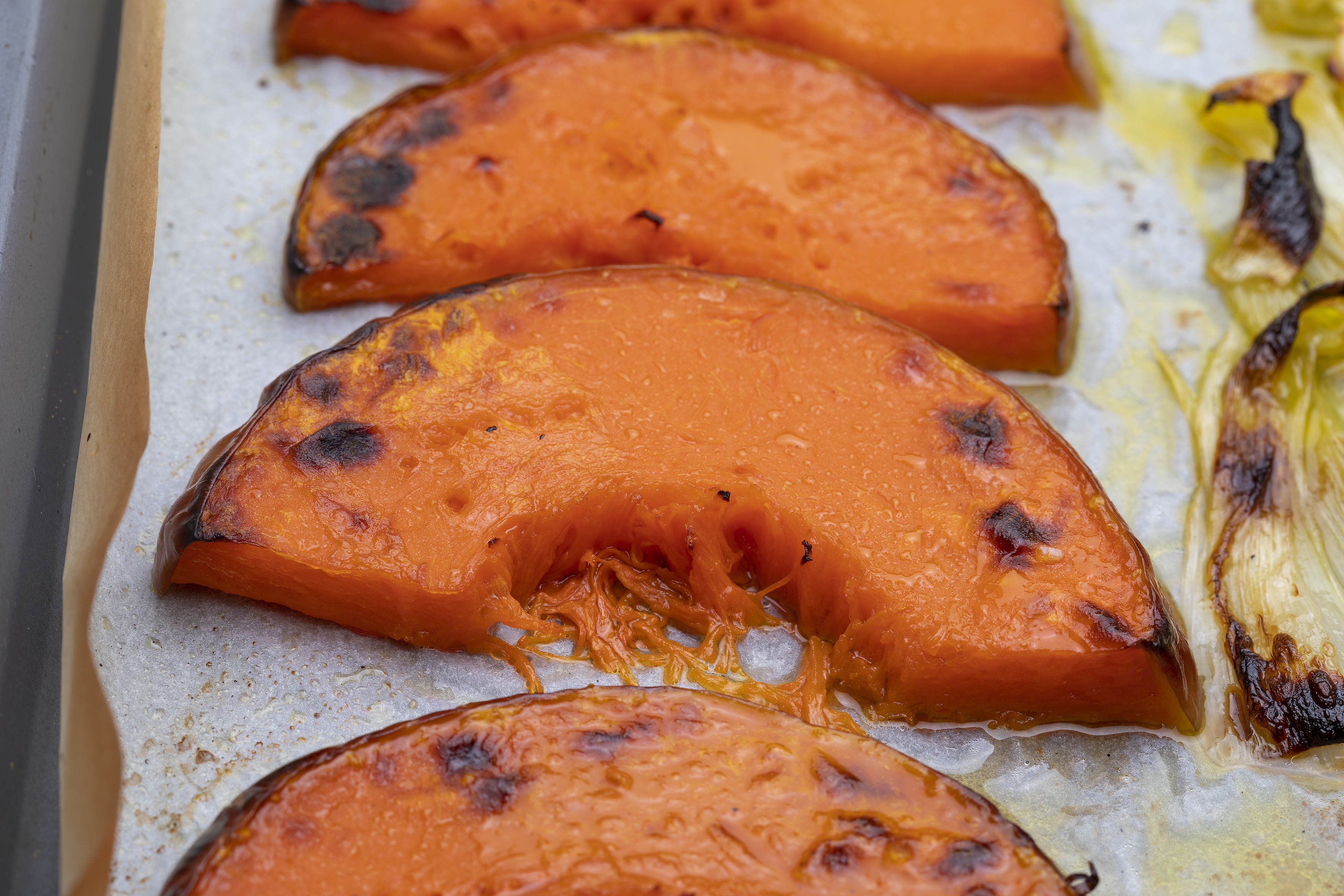 Appetizing,Roasted,Pumpkin,Slices,On,Baking,Tray.,With,Onion.