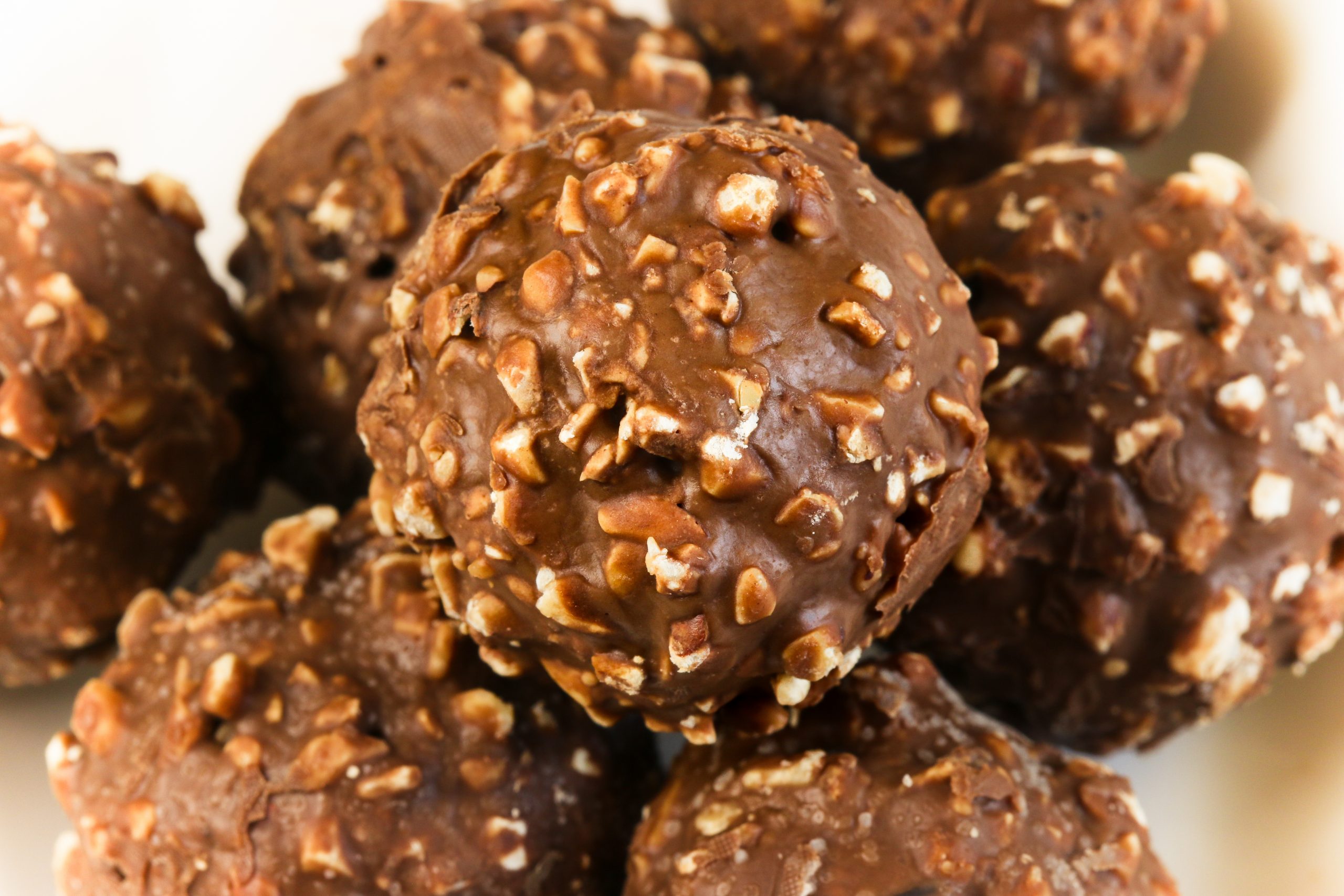 1621001422-16.5.21.-b-Kuglice-roser-stock-photo-closeup-chocolate-ball-sweet-chocolate-mixed-hazelnut-and-walnut-355355009-scaled.jpg