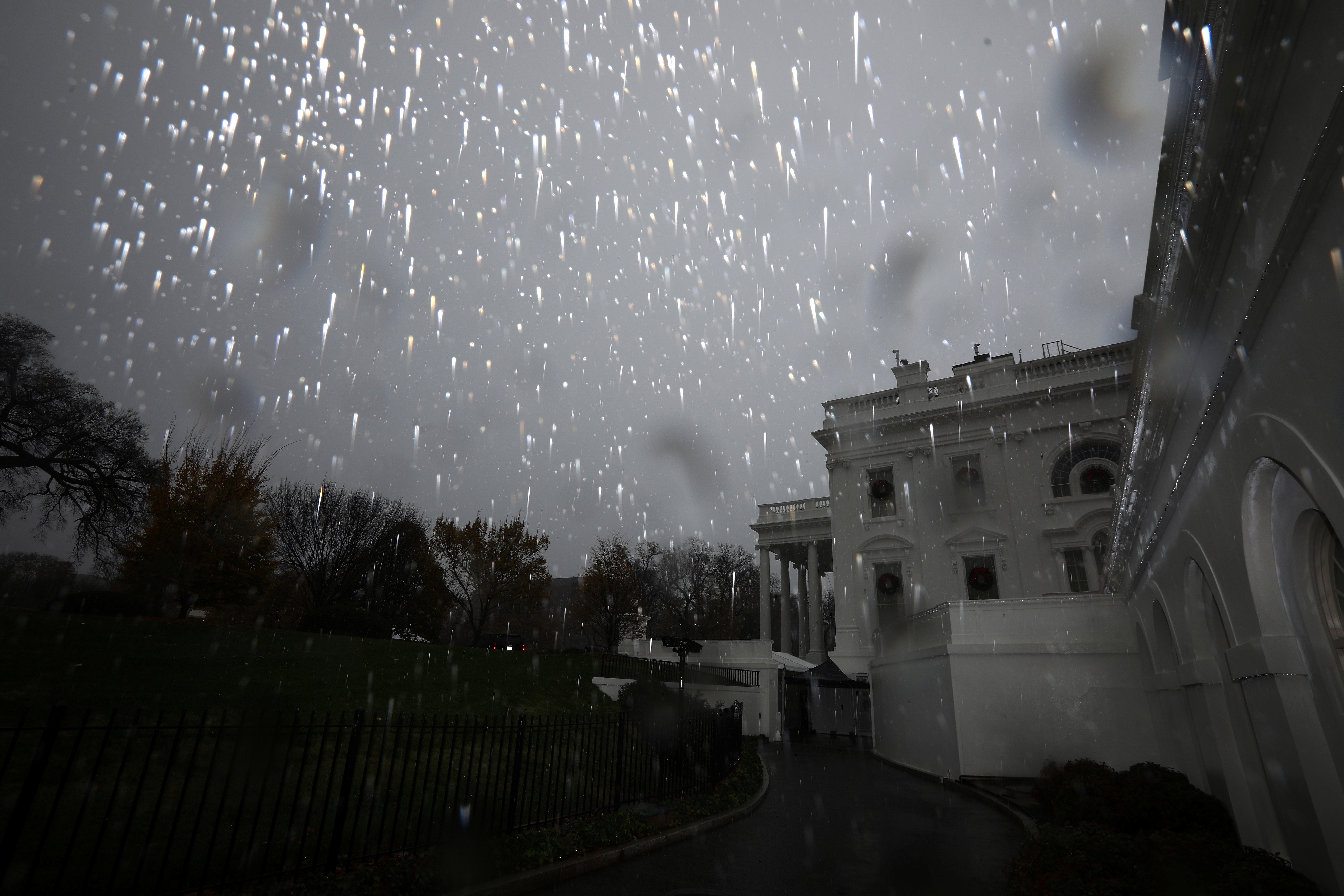 Heavy rain falls over the White House during a storm in Washington, U.S., November 30, 2020.