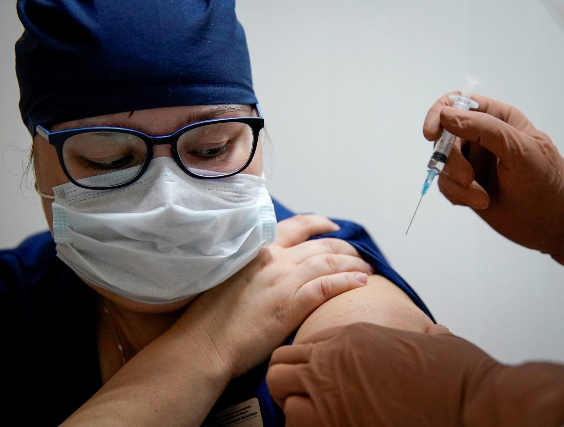 FILE PHOTO: A medic of the regional hospital receives  Russia's "Sputnik V" vaccine shot against the coronavirus disease (COVID-19) in Tver, Russia October 12, 2020.  REUTERS/Tatyana Makeyeva/File Photo