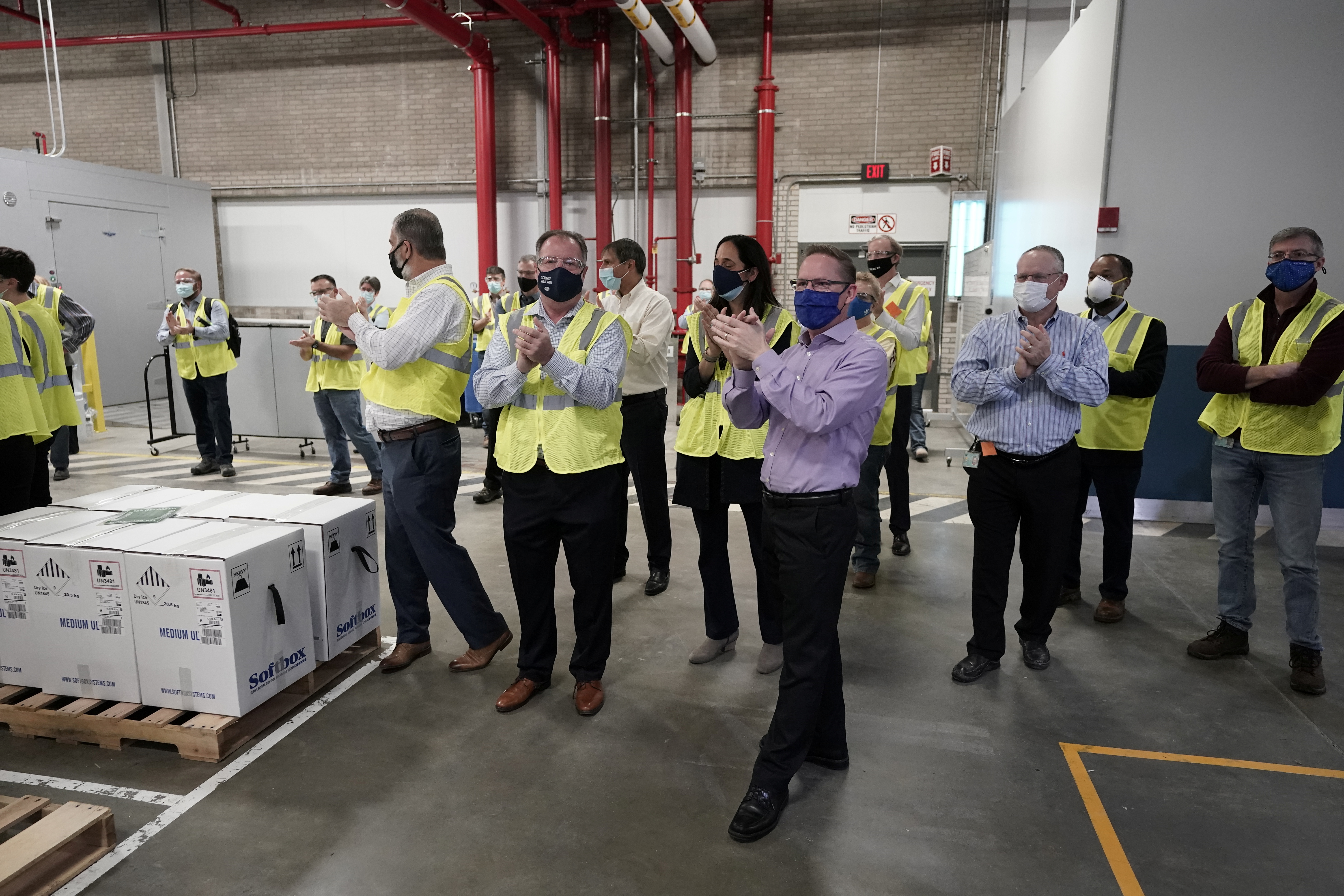 Boxes containing the Pfizer-BioNTech COVID-19 vaccine are prepared to be shipped at the Pfizer Global Supply Kalamazoo manufacturing plant in Portage, Michigan, U.S., December 13, 2020.  Morry Gash/Pool via REUTERS
