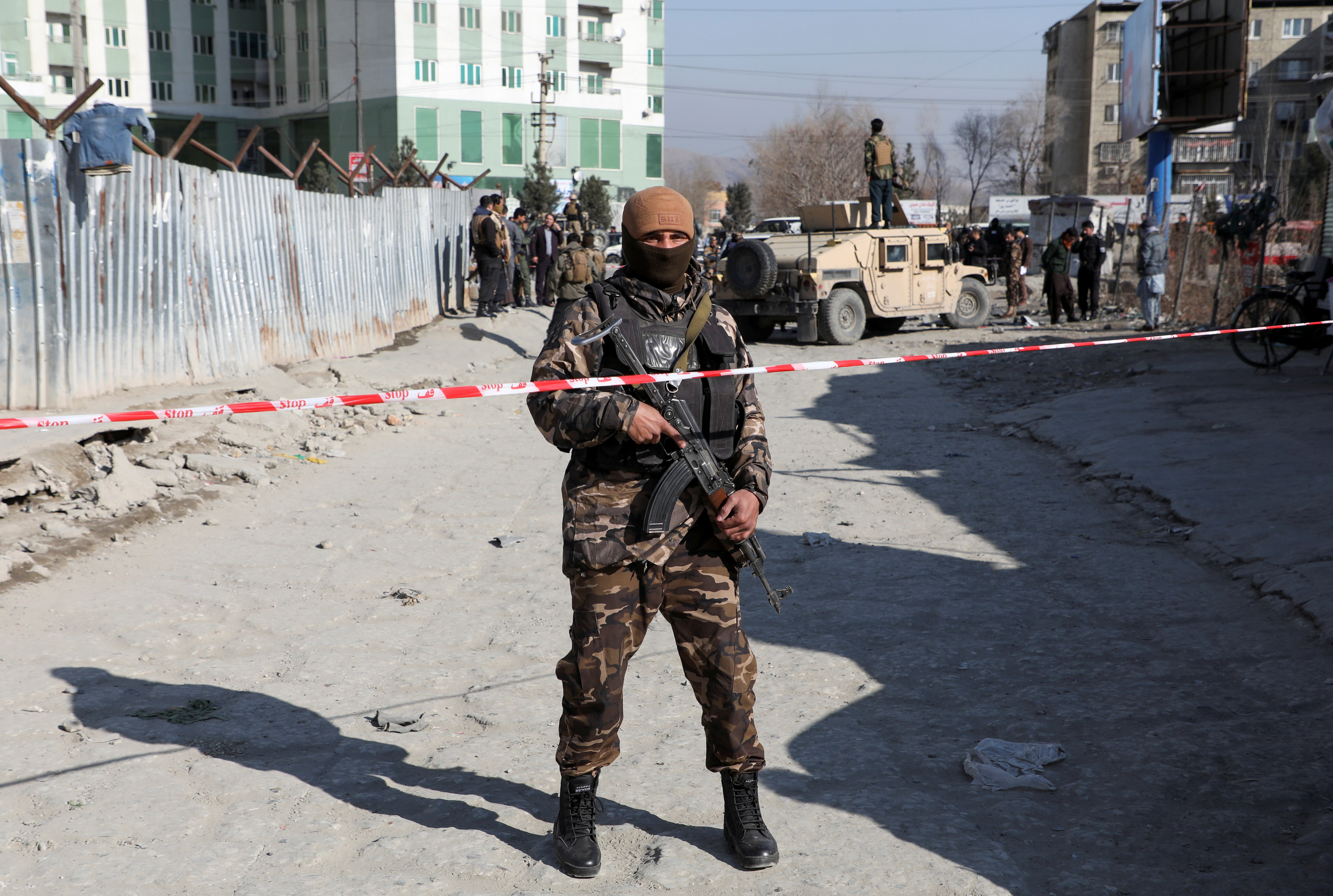 An Afghan security officer stands guard at the site of a bomb blast in Kabul, Afghanistan December 15, 2020. REUTERS/Omar Sobhani