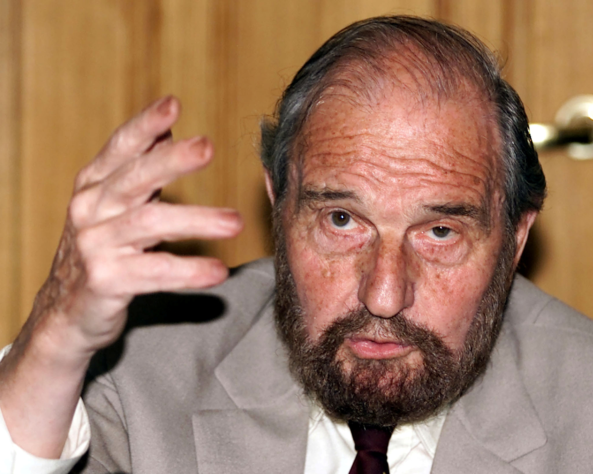 FILE PHOTO: Soviet secret agent George Blake gestures as he speaks at a presentation of a book of letters writte..