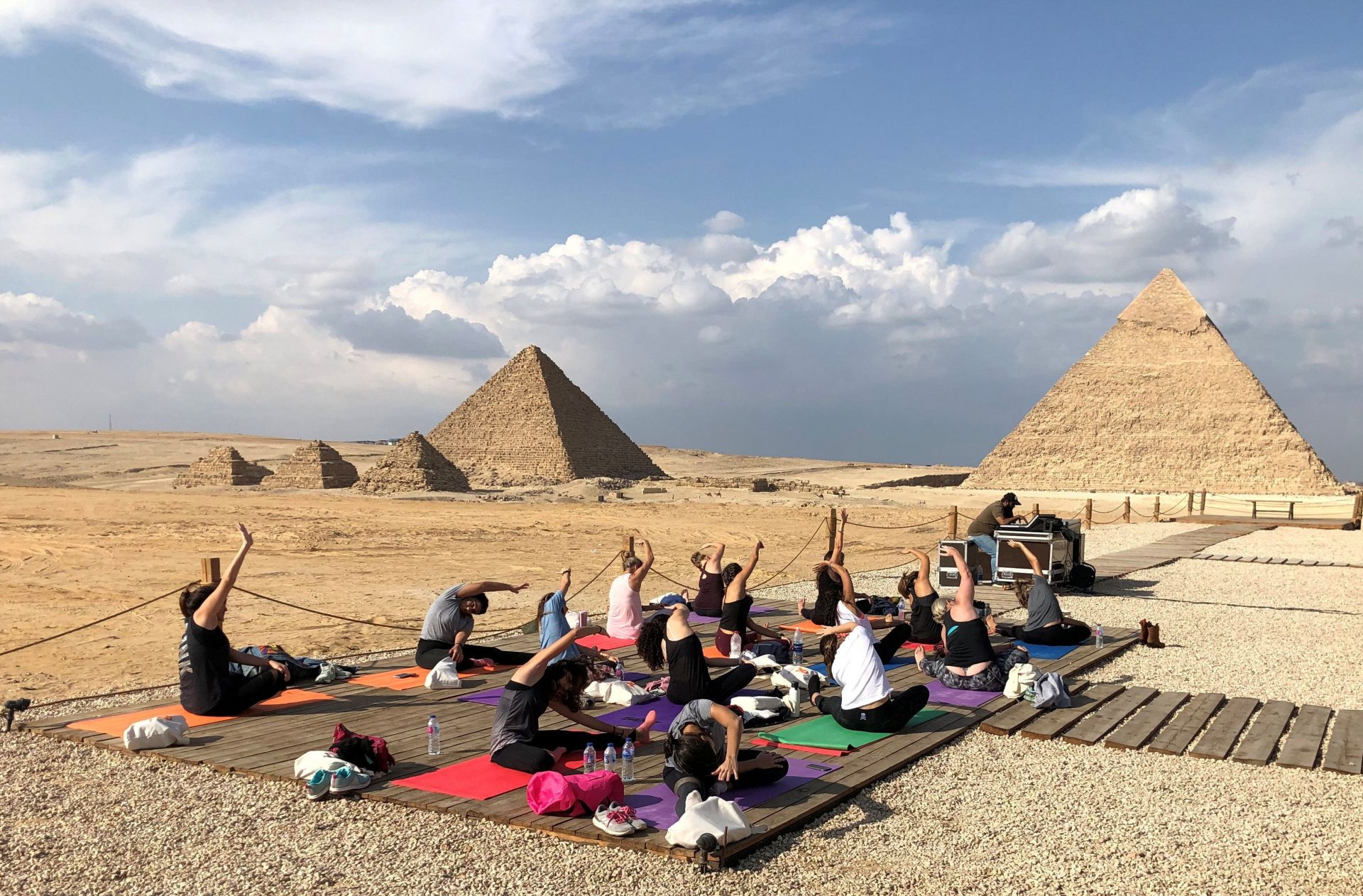 Women attend a Yes Yoga Day event in support of the eradication of violence against women amid the coronavirus disease (COVID-19) in front of the historical Giza pyramids, Egypt, November 7, 2020. REUTERS/Ahmed Fahmy     TPX IMAGES OF THE DAY