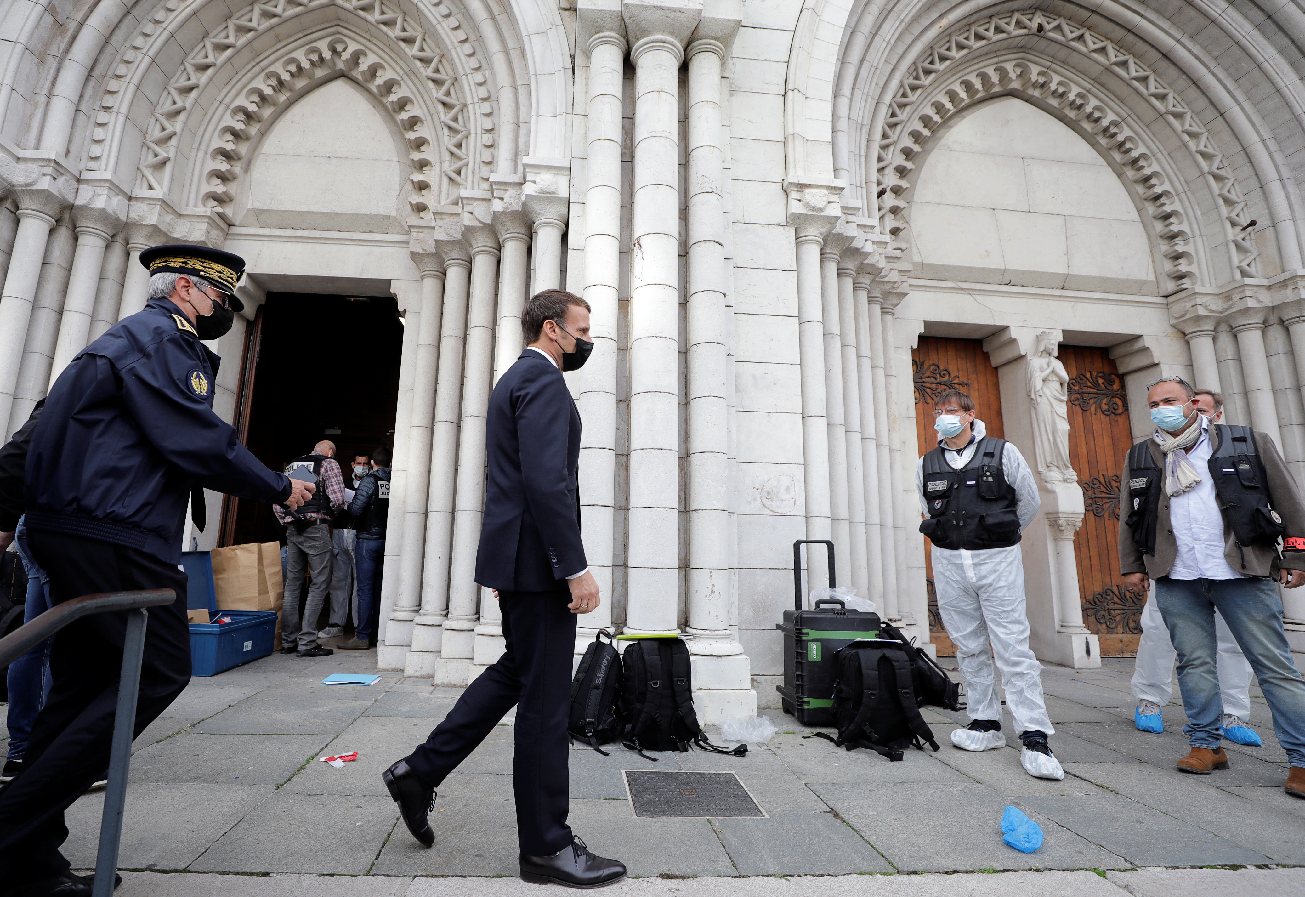 French President Emmanuel Macron visits the scene of a knife attack at Notre Dame church in Nice, France, October 29, 2020. REUTERS/Eric Gaillard/Pool