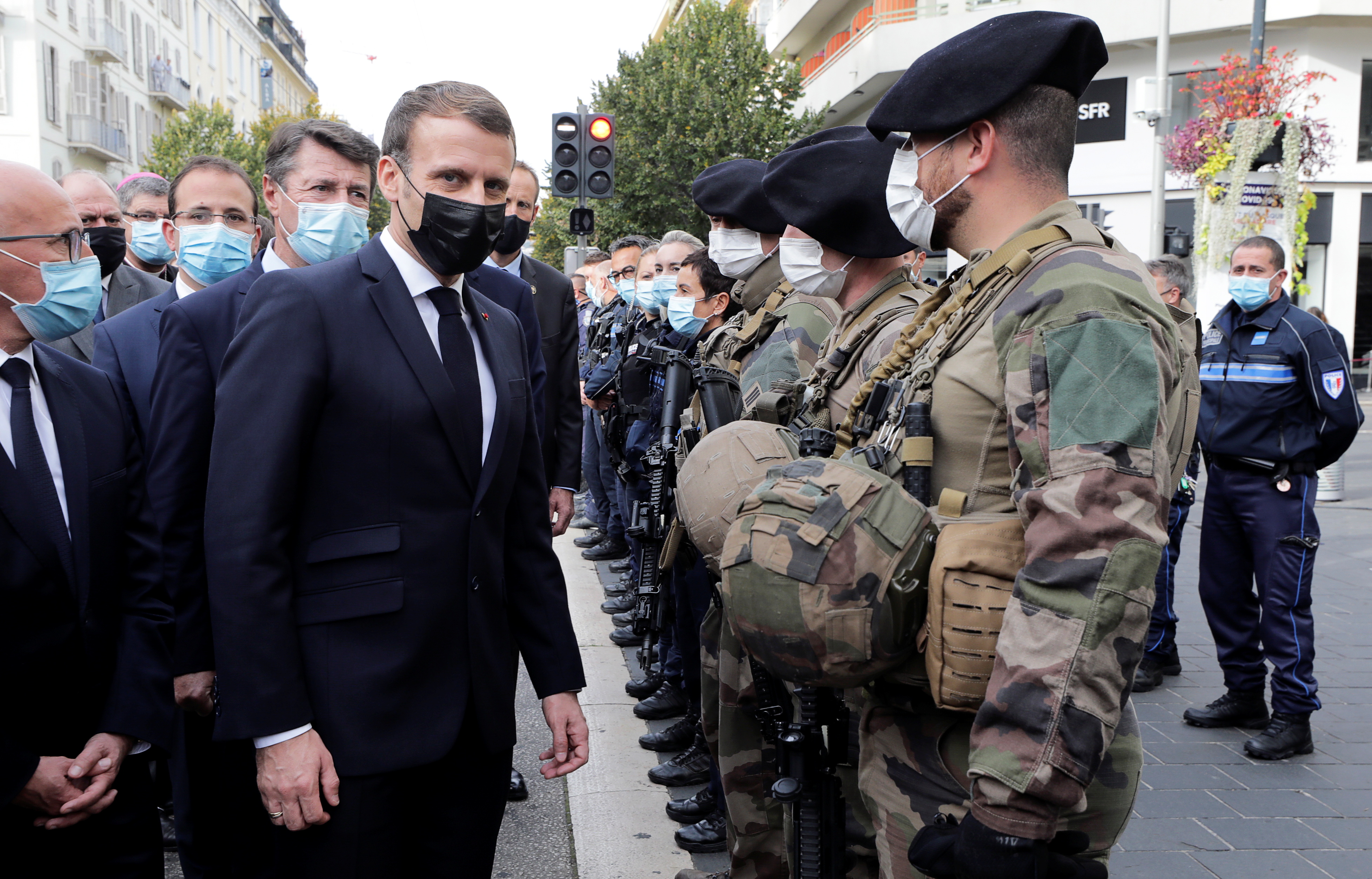 French President Emmanuel Macron and Nice Mayor Christian Estrosi visit the scene of a knife attack at Notre Dame church in Nice, France, October 29, 2020. REUTERS/Eric Gaillard/Pool