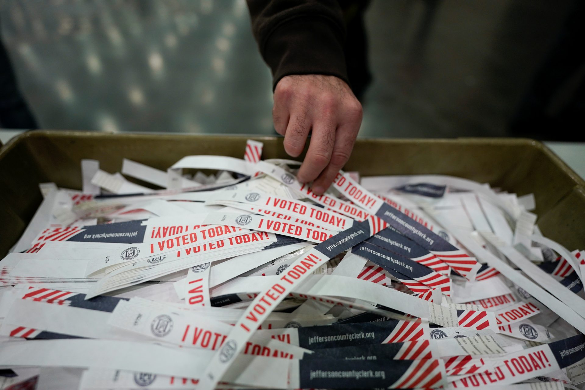 A voter takes a "I voted today" badge at the Kentucky Exposition Center during the election in Louisville, Kentucky, U.S. November 3, 2020.  REUTERS/Bryan Woolston