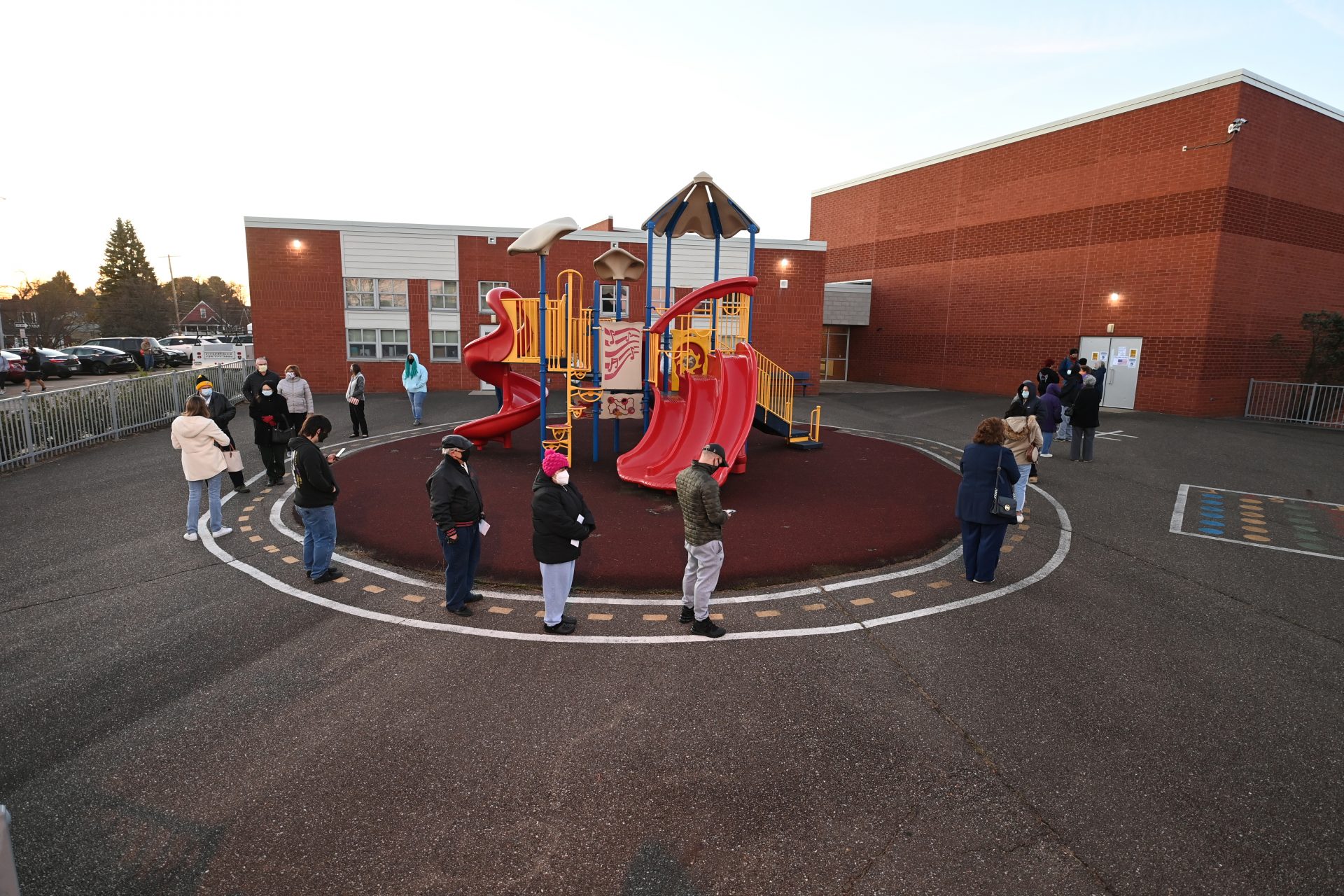 Voters line up at sunrise at Highland Elementary School in Ambridge, Beaver County, Pennsylvania, U.S. November 3, 2020. REUTERS/Alan Freed