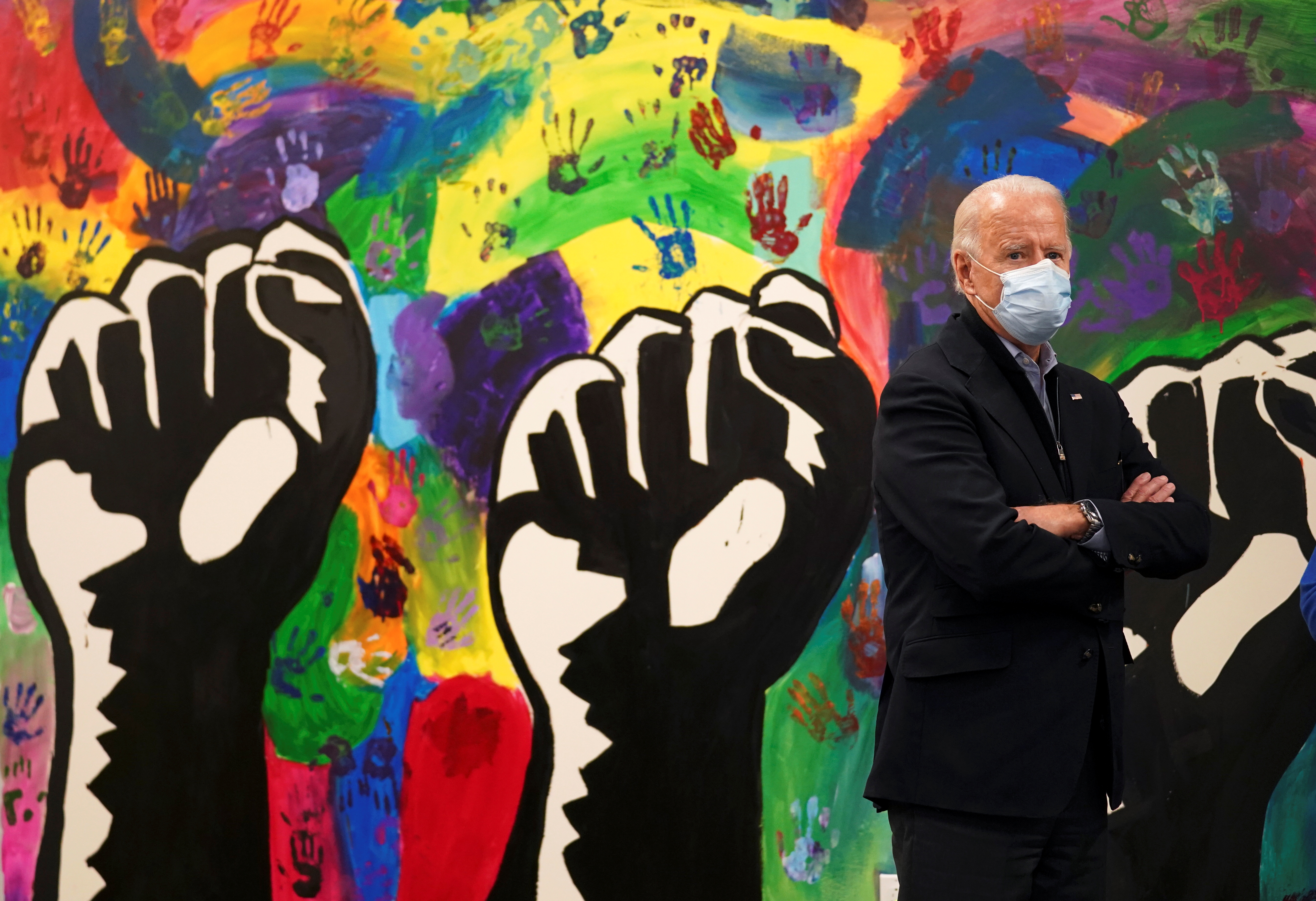 U.S. Democratic presidential nominee Joe Biden stands by a mural during a stop on Election Day at a teen center in Wilmington, Delaware, U.S. November 3, 2020. REUTERS/Kevin Lamarque