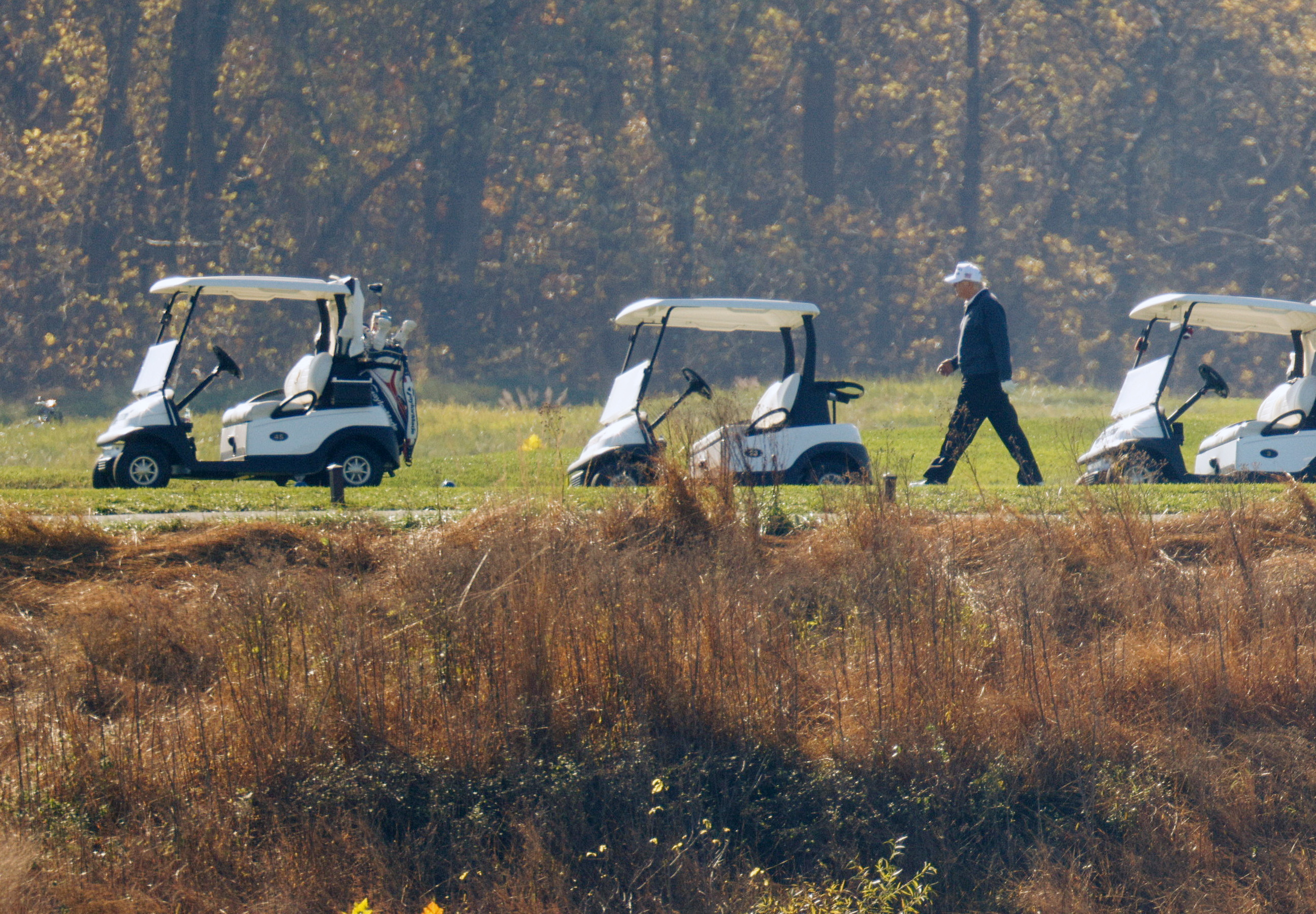 U.S. President Donald Trump plays golf at the Trump National Golf course in Virginia