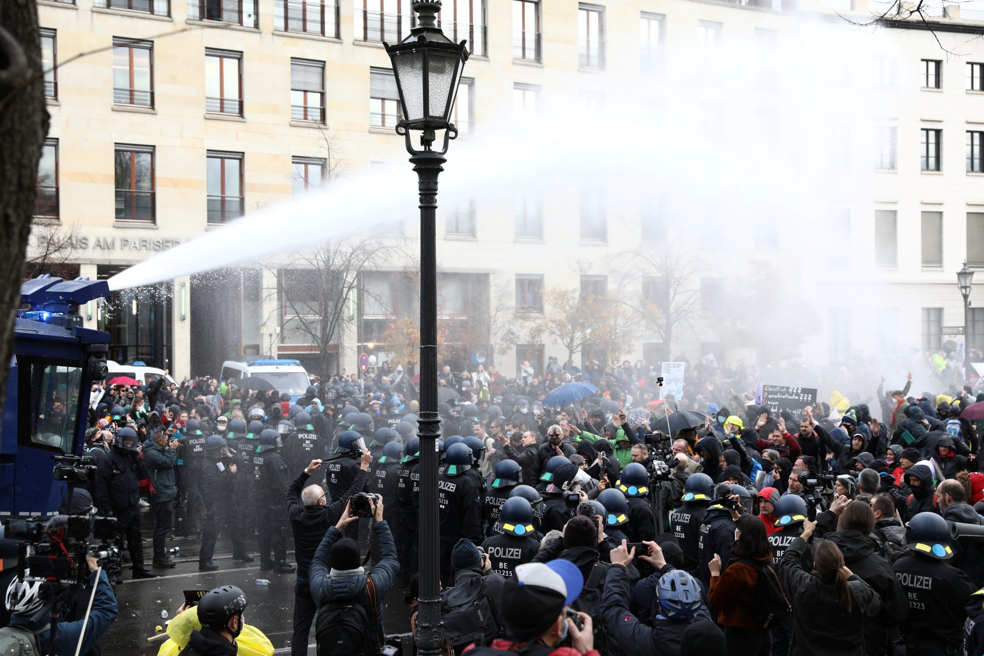 Police use water cannons during a protest against the government's coronavirus disease (COVID-19) restrictions, near the Reichstag, the seat of Germany's lower house of parliament Bundestag, in Berlin, November, 18, 2020. REUTERS/Christian Mang