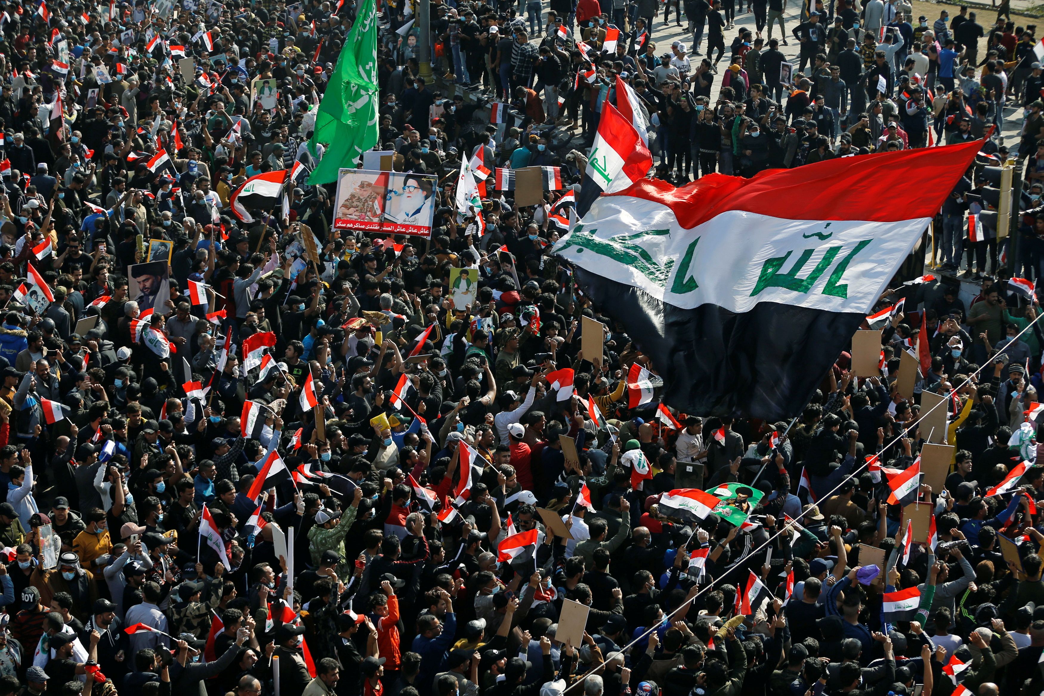Supporters of Iraqi Shi'ite cleric Moqtada al-Sadr gather during a rally in support of al-Sadr at Tahrir Square in Baghdad, Iraq November 27, 2020. REUTERS/Khalid al-Mousily