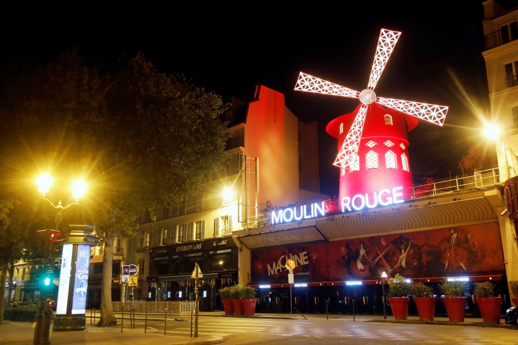 A view shows empty streets around the Moulin Rouge cabaret during the late-night curfew due to restrictions against the spread of the coronavirus disease (COVID-19) in Paris, France, October 17, 2020. REUTERS/Charles Platiau