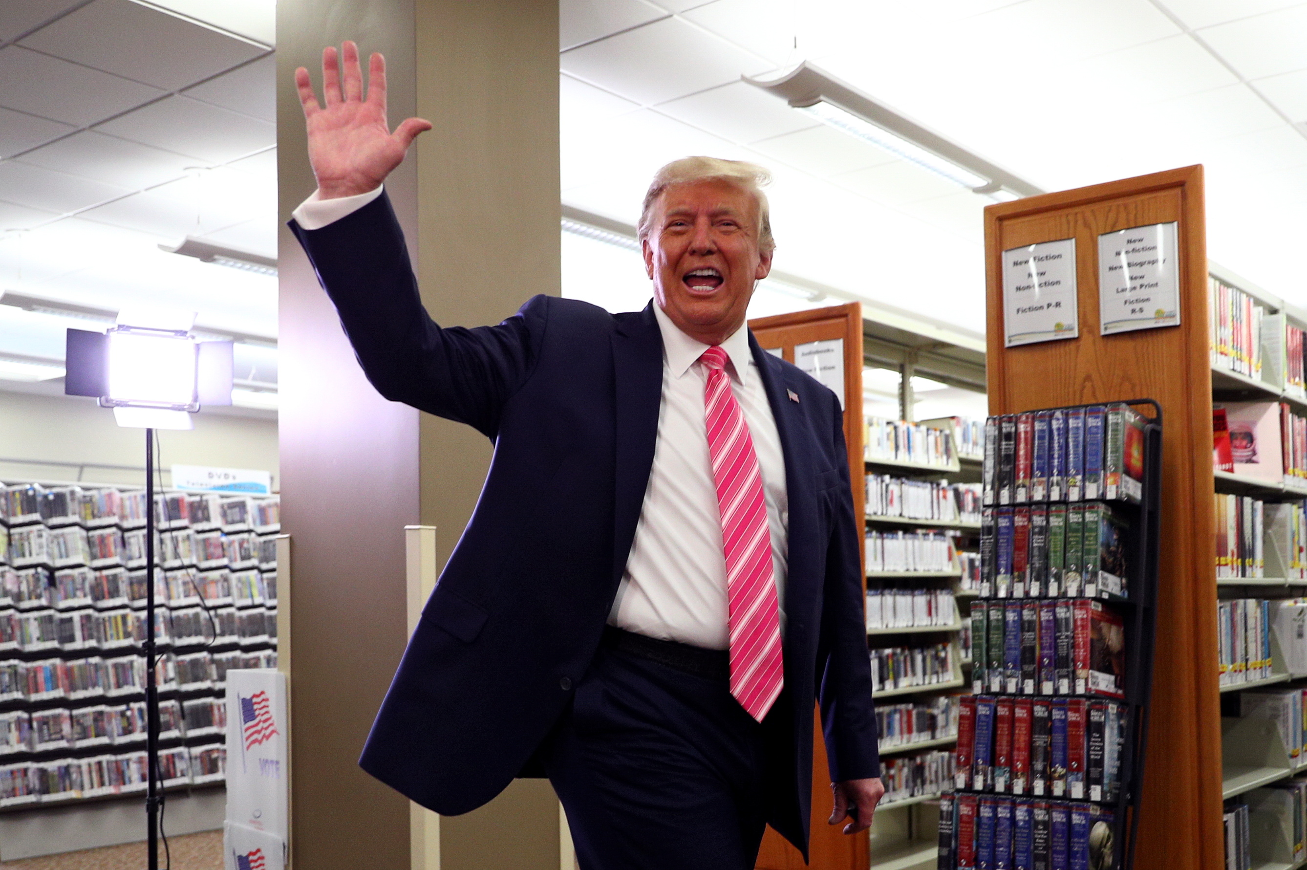 U.S. President Donald Trump waves after voting in the 2020 presidential election at the Palm Beach County Library in West Palm Beach, U.S., October 24, 2020. REUTERS/Tom Brenner