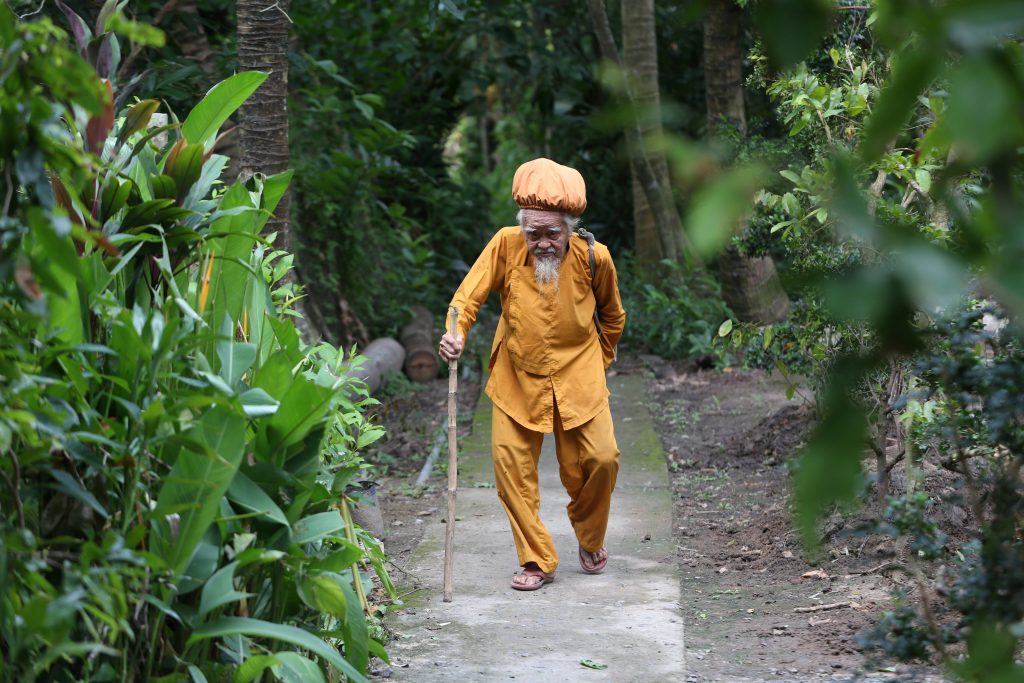 Nguyen Van Chien, 92, walks in his home in Tien Giang province, Vietnam , August 21, 2020. Picture taken August 21, 2020. REUTERS/Yen Doung