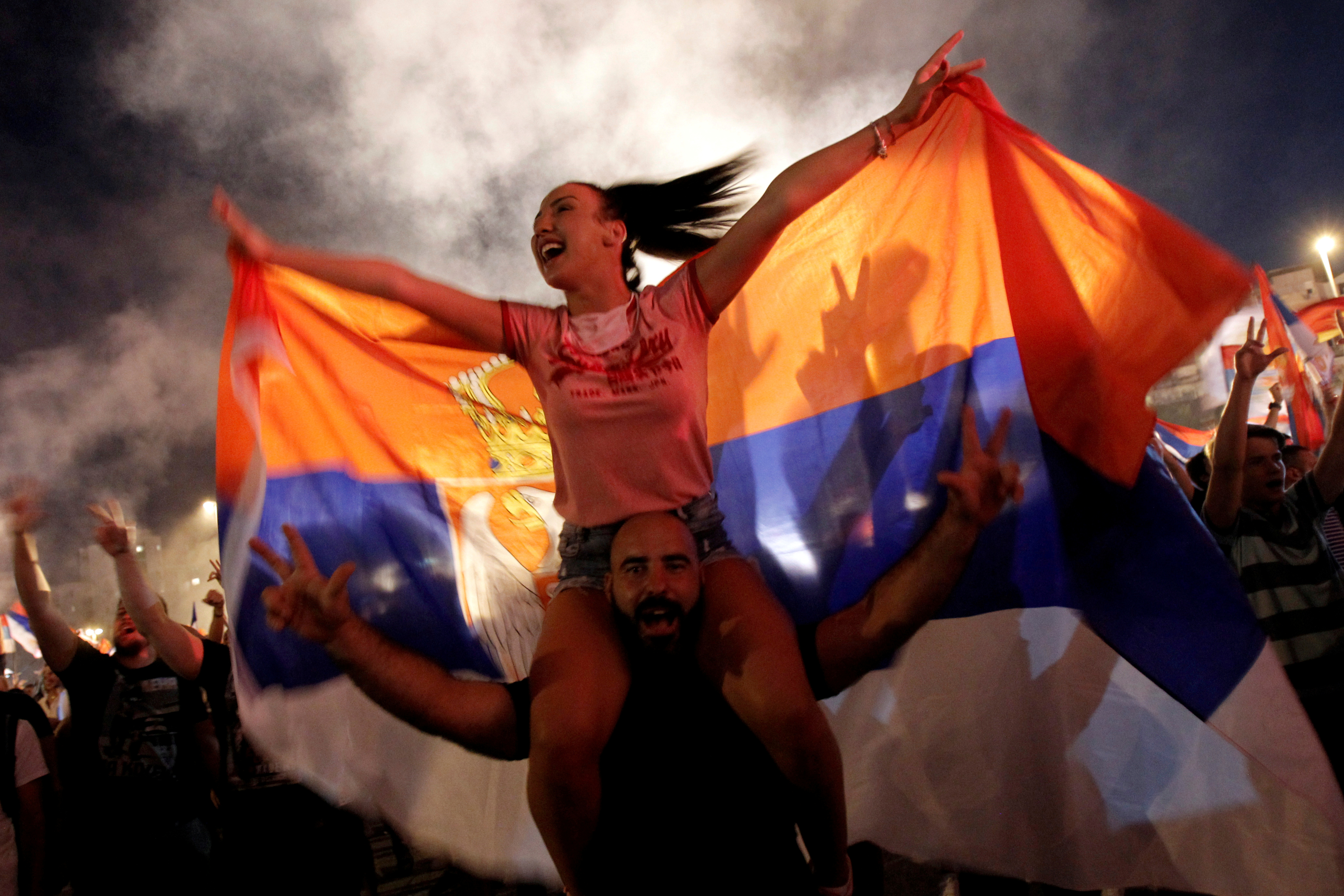 Pro-Serb opposition supporters celebrate in front of the Cathedral of the Resurrection of Christ in Podgorica, Montenegro August 31, 2020. REUTERS/Stevo Vasiljevic     TPX IMAGES OF THE DAY