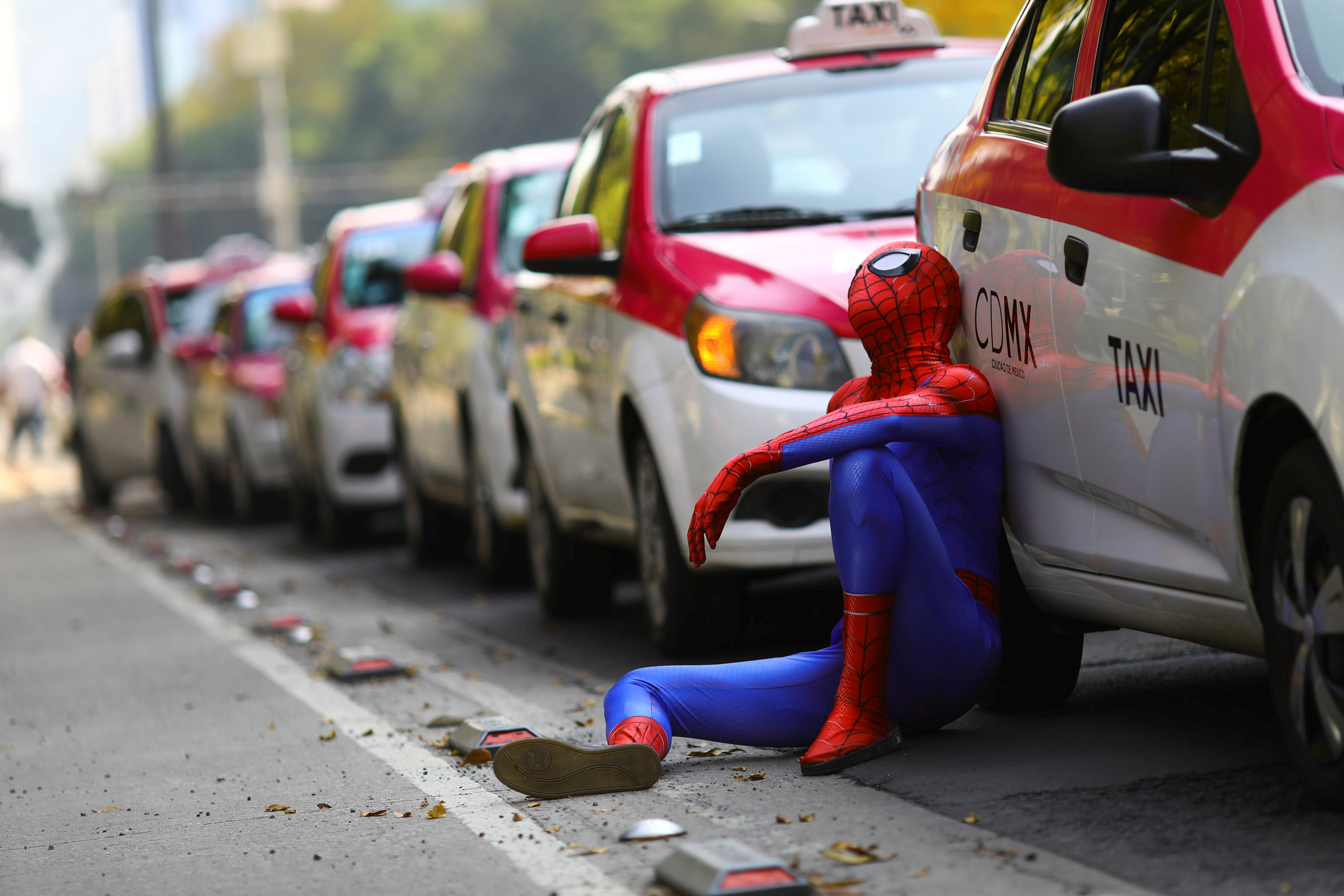 Taxi drivers hold a protest against taxi-hailing apps such as Uber, Cabify and Didi at Angel de la Independencia monument, in Mexico City