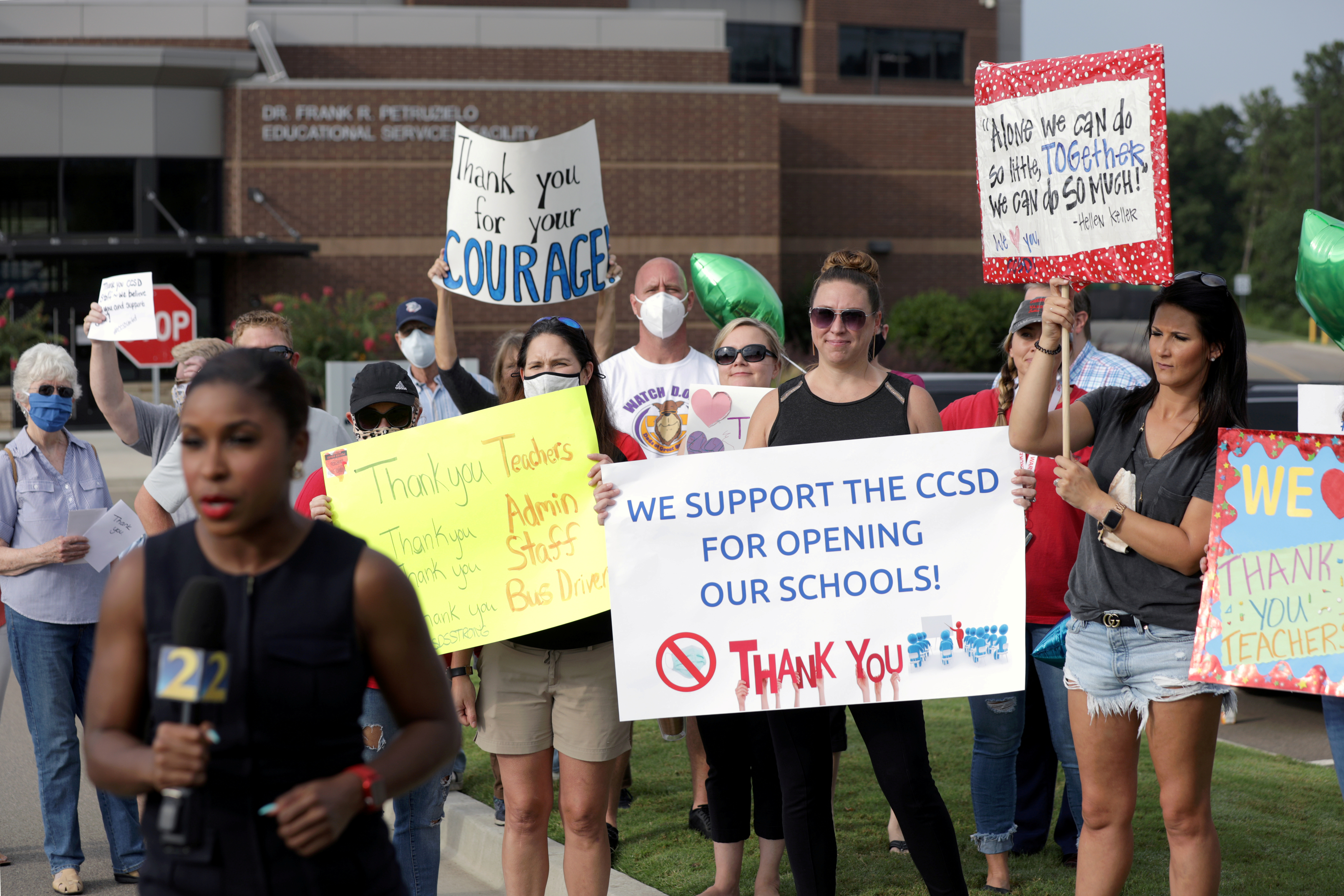 Supporters of school district's decision to reopen schools rally in Canton