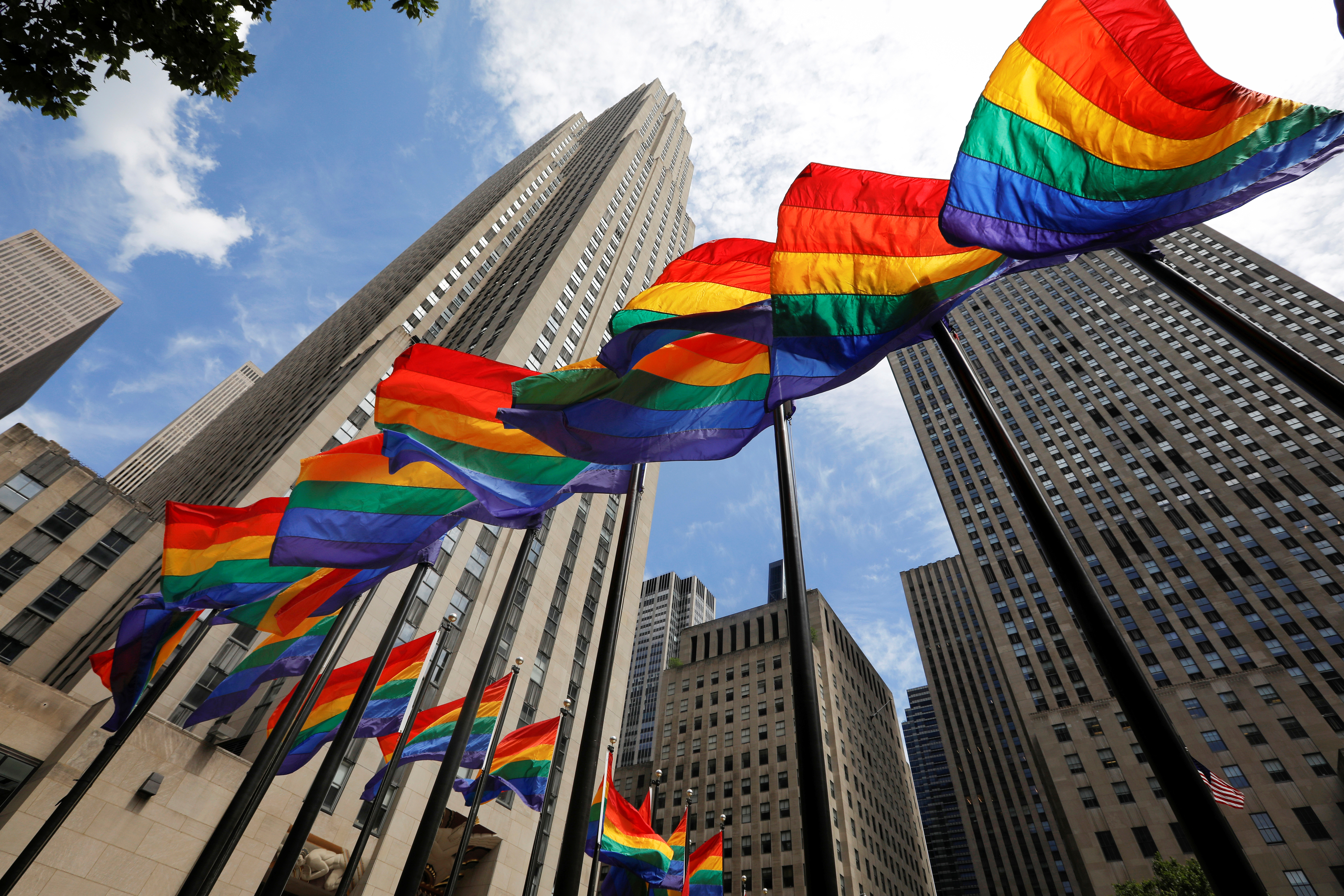Rainbow flags fly at Rockefeller Center in midtown Manhattan in support of the LGBT community, prior to the 51st anniversary of the Stonewall Uprising, in New York City, New York, U.S., June 26, 2020. REUTERS/Mike Segar