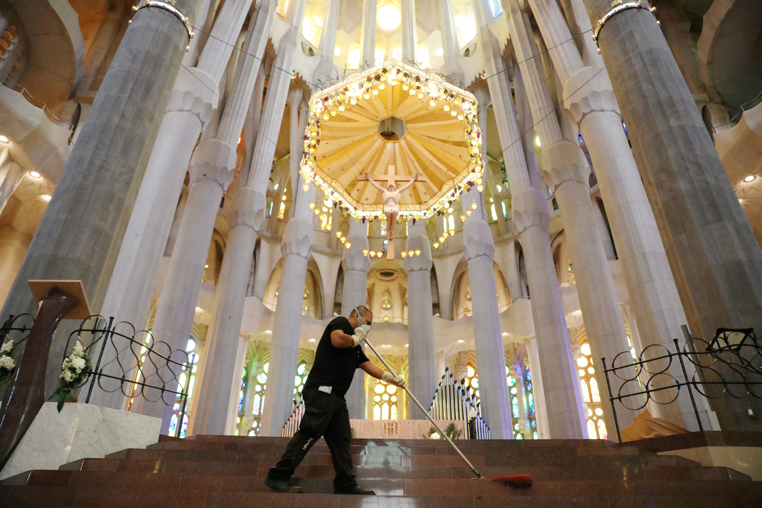 A man cleans the Sagrada Familia basilica a day ahead of its reopening, after being closed for over three months due to the coronavirus disease (COVID-19) outbreak, in Barcelona, Spain July 3, 2020. REUTERS/Nacho Doce
