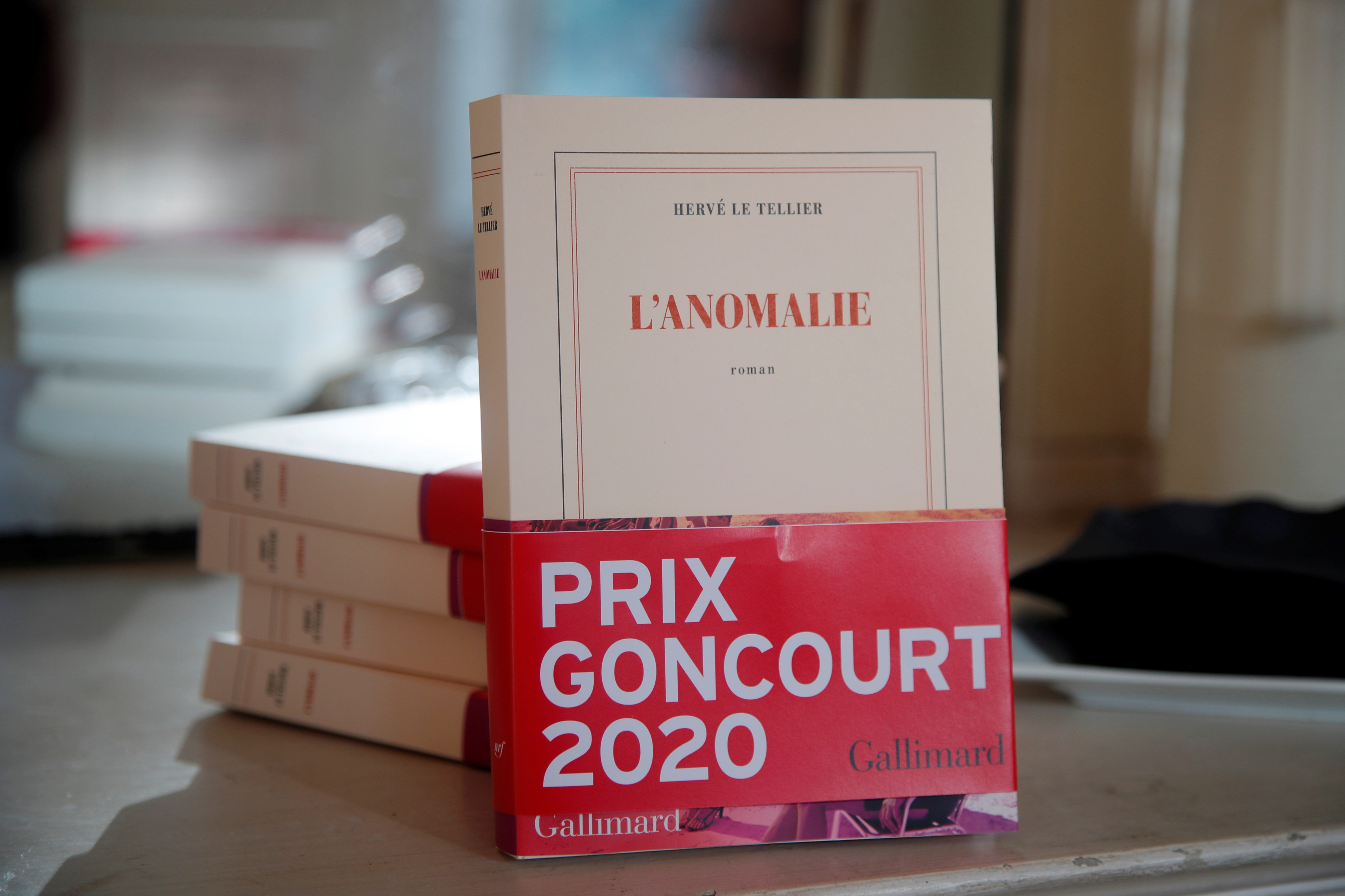 Copies of the novel "L'Anomalie"  (The Anomaly) by French writer Herve Le Tellier, 2020 Prix Goncourt literary prize, are seen at publishing house Gallimard in Paris, France, November 30, 2020. REUTERS/Charles Platiau