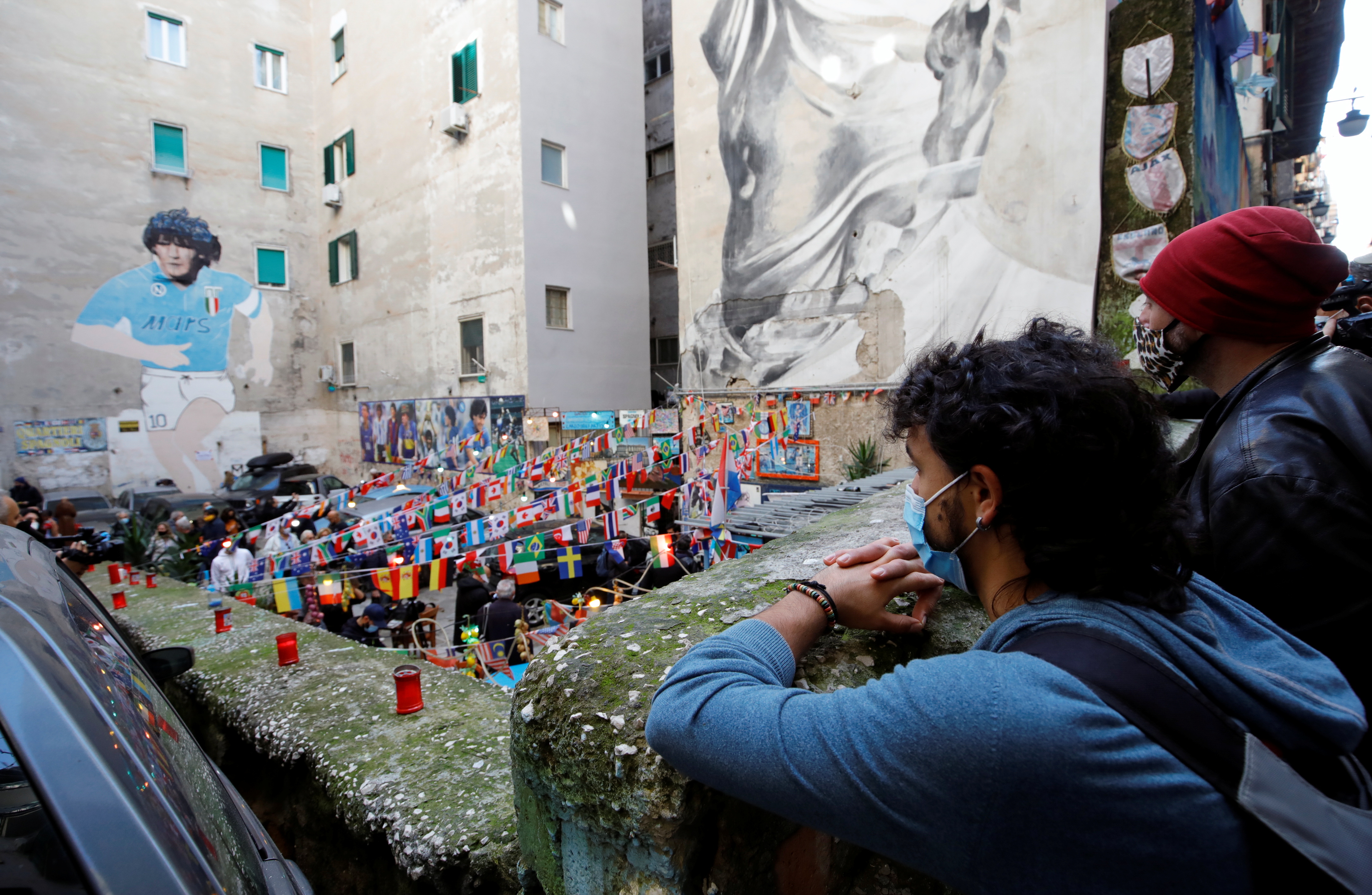 People gather to mourn the death of Argentine soccer legend Diego Maradona in Naples