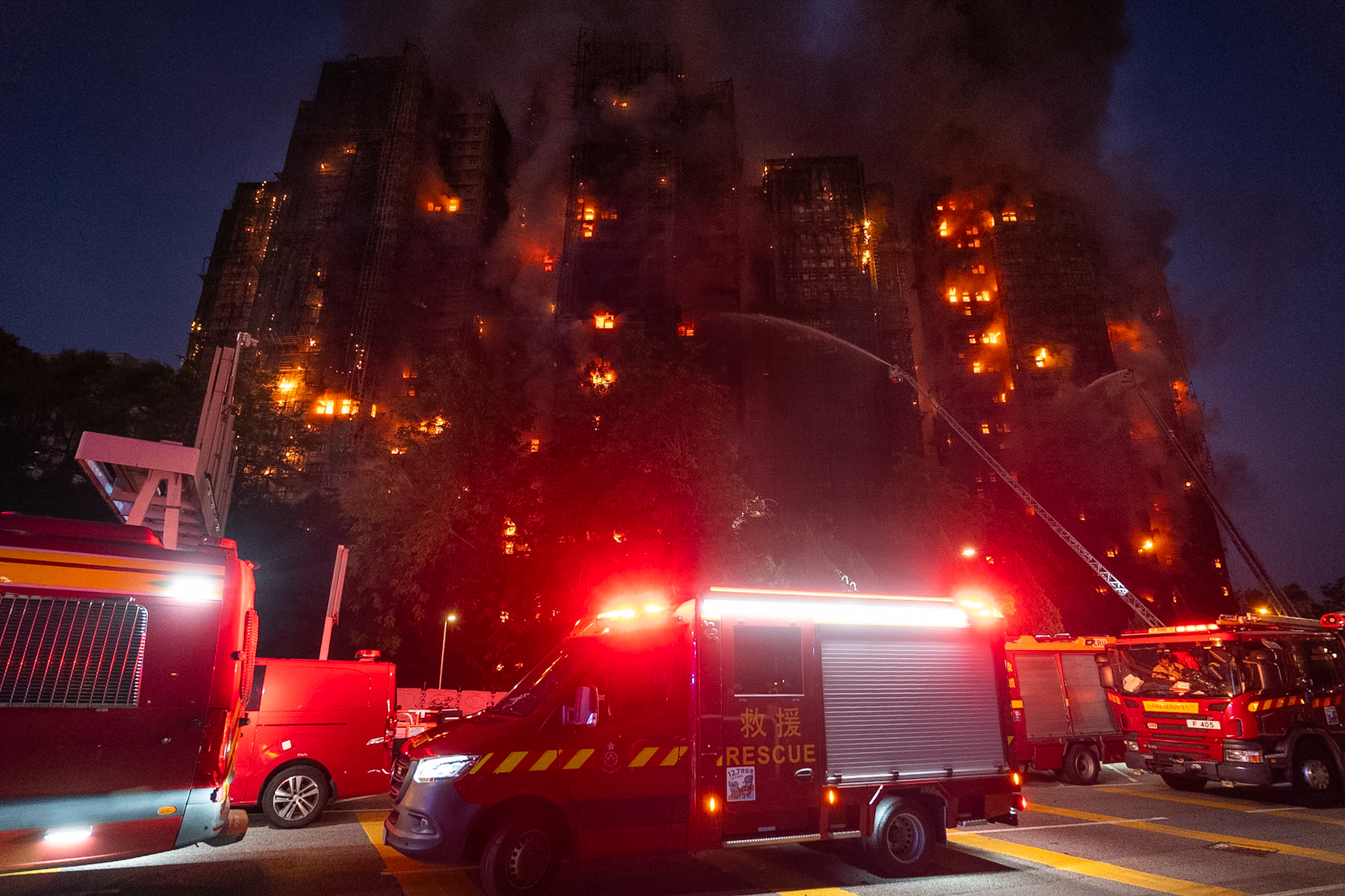 Firefighters try to extinguish a fire that broke out at Wang Fuk Court, a residential estate in the Tai Po district of Hong Kong's New Territories, Wednesday, Nov. 26 2025. (AP Photo/Chan Long Hei)